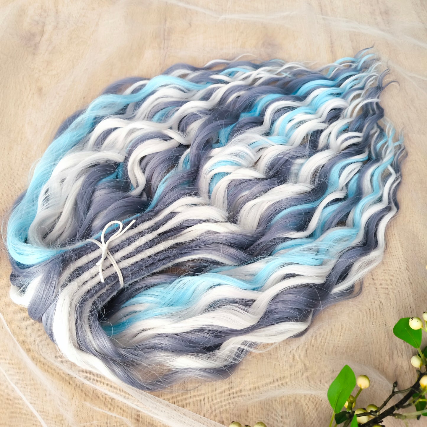 Let your hair channel the raw beauty of the Arctic with this striking icy blend. Arctic Ice features cool-toned waves in glacier blue, soft white, and smoky gray, flowing together like frozen mist over a winter sea.
Elegant, bold, and ethereal — this set is perfect for anyone who loves a crisp, dramatic look with an icy twist.