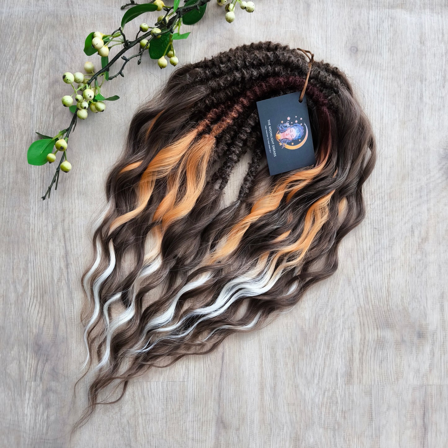 This moody, elegant set of soft, lightweight, and reusable synthetic brushable double-ended wavy dreadlocks features 2 shades of brown as the main color, enriched with calico strands.