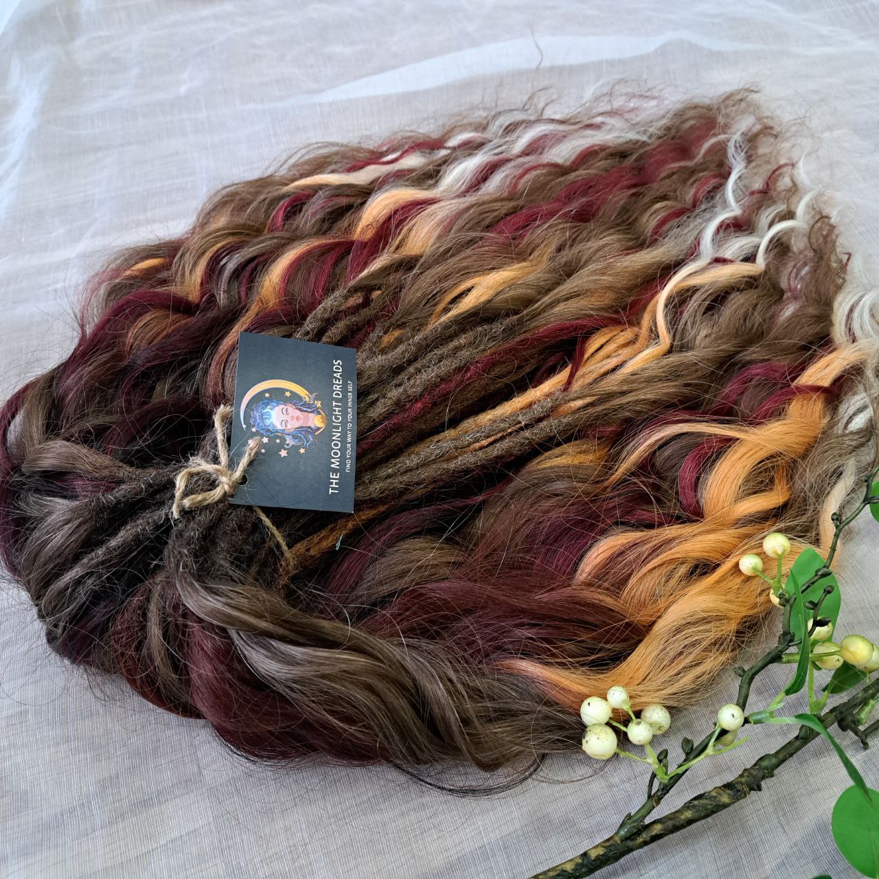 Autumn Garnet Smoke is a variation of the popular Autumn Smoke set with the addition of rich burgundy strands. Inspired by the richness of autumn and the depth of garnet, this set combines warm smoky browns and golden tones with bold burgundy accents. The blend creates a look that is both elegant and powerful, perfect for those who want to highlight their individuality with a touch of autumn mystery.