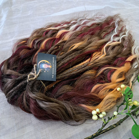 Autumn Garnet Smoke is a variation of the popular Autumn Smoke set with the addition of rich burgundy strands. Inspired by the richness of autumn and the depth of garnet, this set combines warm smoky browns and golden tones with bold burgundy accents. The blend creates a look that is both elegant and powerful, perfect for those who want to highlight their individuality with a touch of autumn mystery.