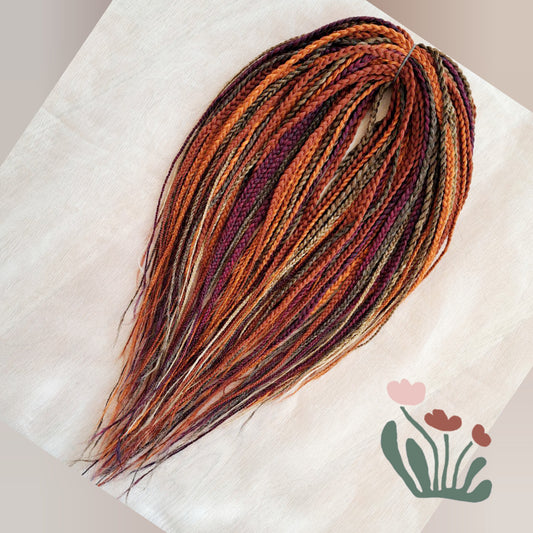 Inspired by the original Spiced Amber set, this braided version combines all the warmth and depth of autumn hues in a new texture and tone. Here, rich amber and copper shades are balanced by earthy brown, honey caramel, and subtle chestnut notes — creating a natural yet vibrant color harmony.
