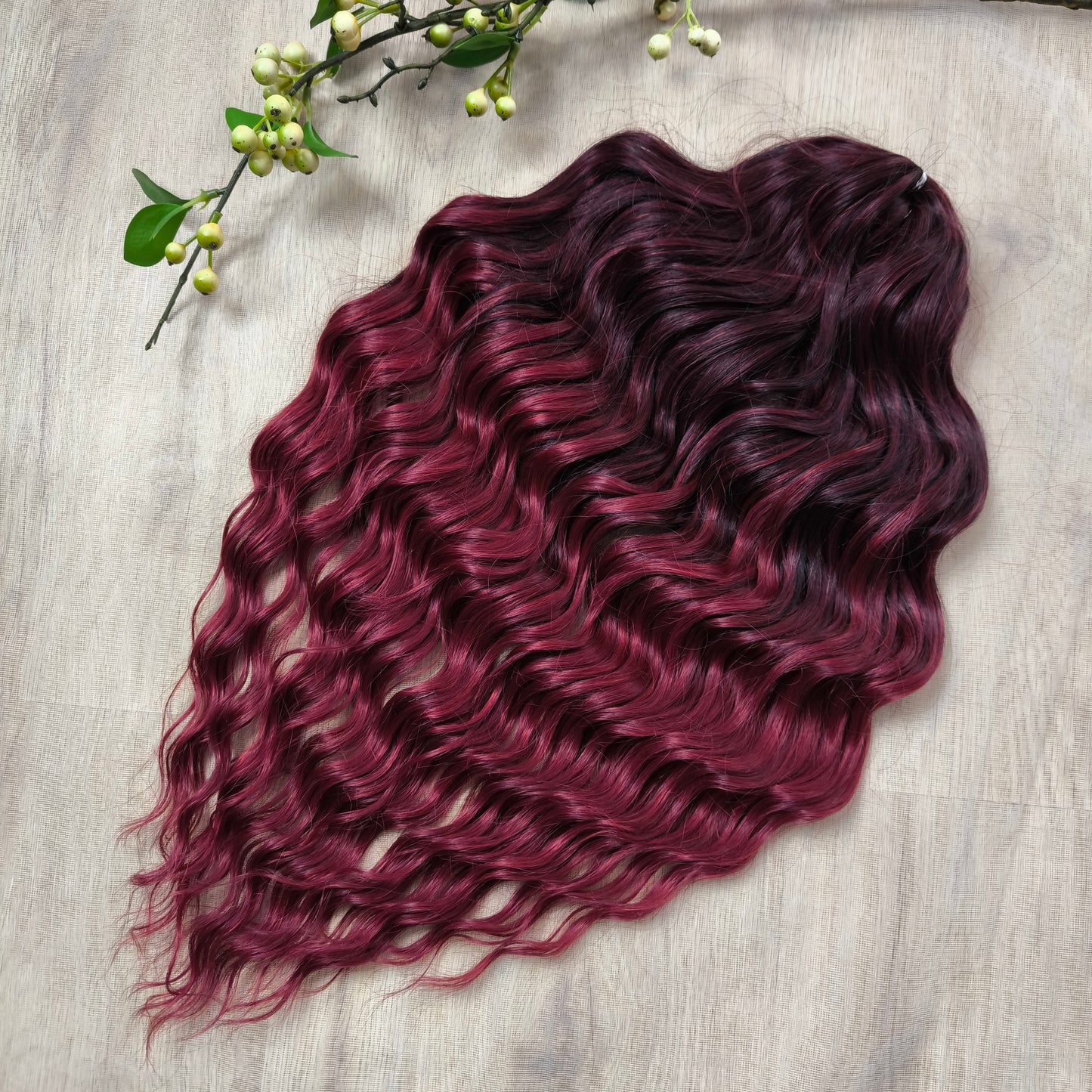 Maroon soft, lightweight, and reusable synthetic brushable double ended wavy dreadlocks.