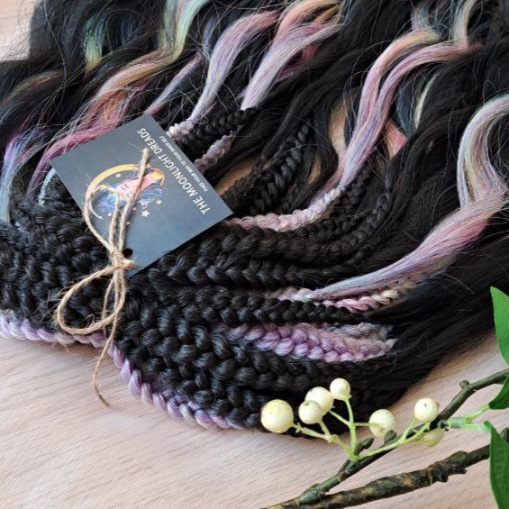 The mix of Black and Rainbow/glitch/prism effect (2/3 parts of black + 1/3 part of rainbow) soft, lightweight, and reusable synthetic brushable double ended wavy dreadlocks.