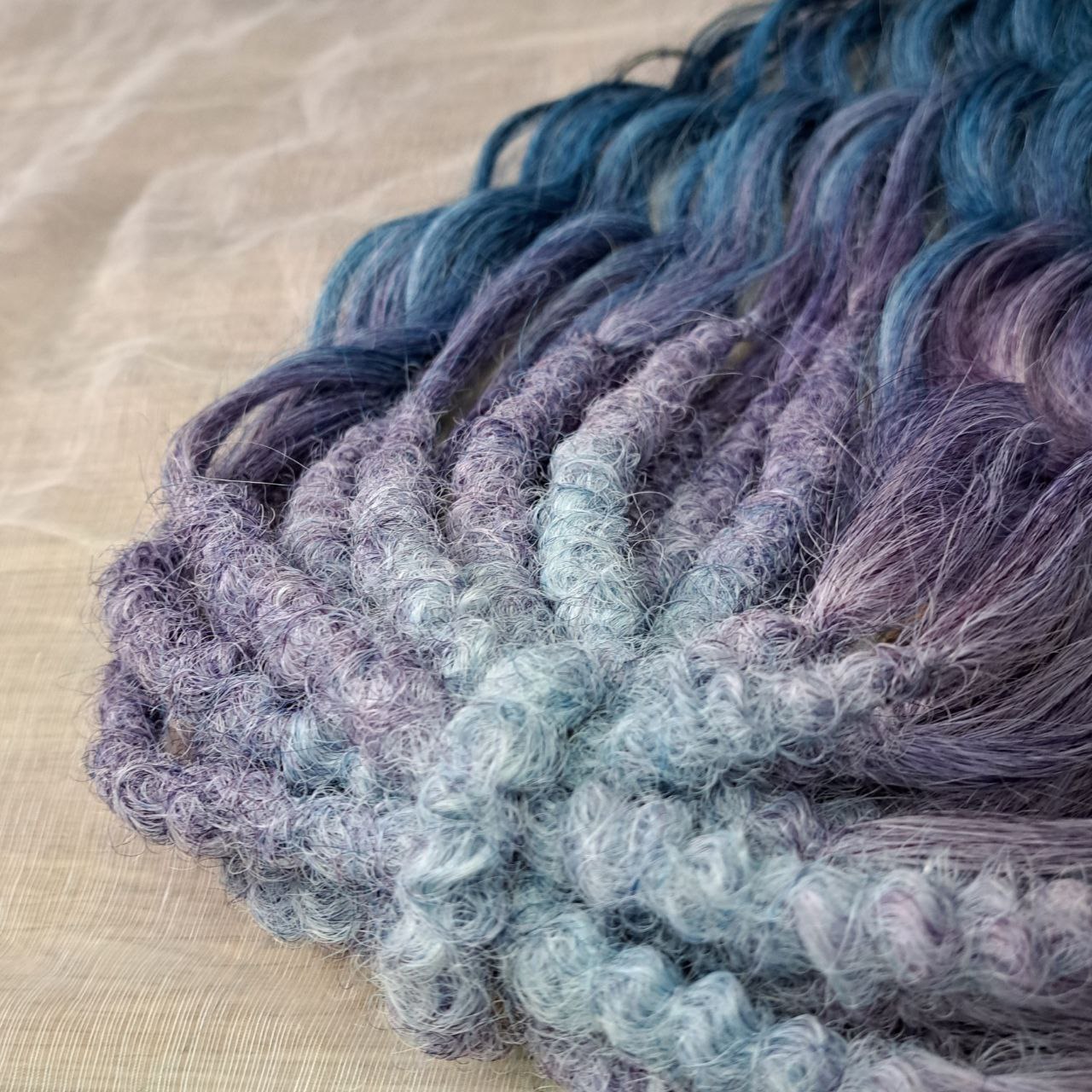 This set features a smooth lavender-to-indigo gradient with cool, clean tones and a soft transition between shades. Soft, lightweight, and reusable double ended synthetic brushable curls.