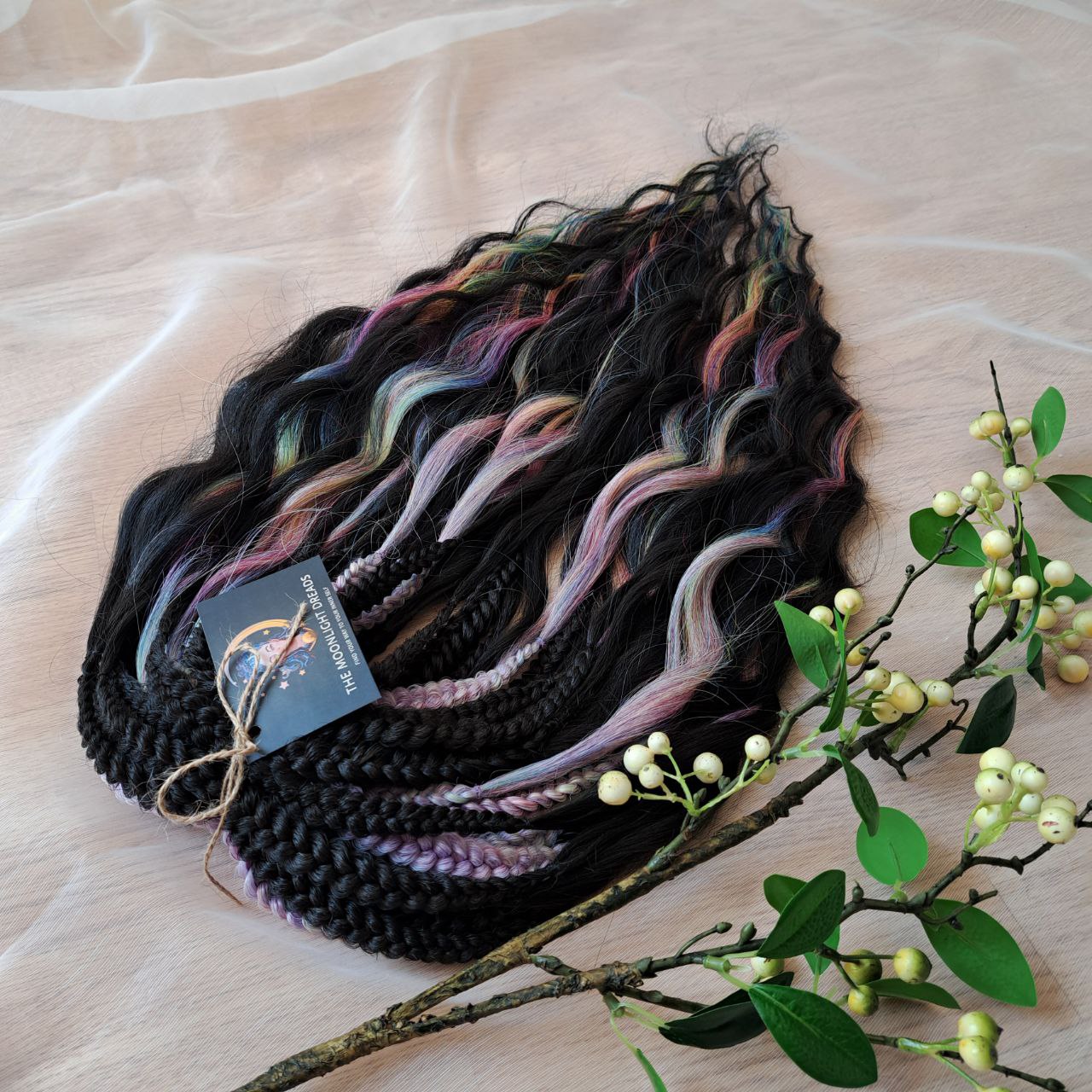 The mix of Black and Rainbow/glitch/prism effect (2/3 parts of black + 1/3 part of rainbow) soft, lightweight, and reusable synthetic brushable double ended wavy dreadlocks.