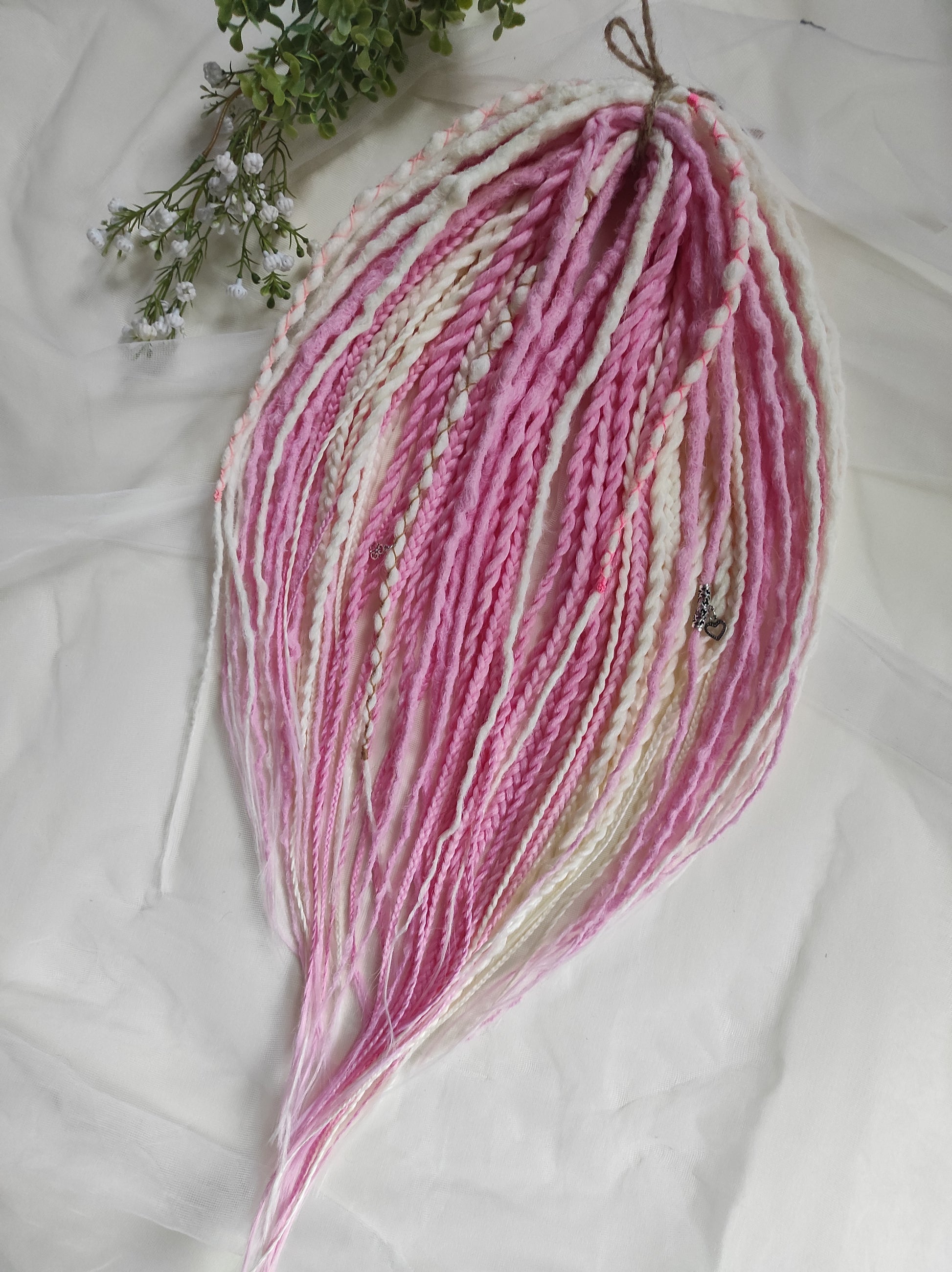 A soft blend of creamy white and gentle pink tones double ended crochet bumpy dreads, braids, and Senegalese twists. Decoration is included. Reusable lightweight set made from high-quality synthetic hypoallergenic material kanekalon.

Standard length: ±22-24 inches (55-60 cm)
Thickness of dreads and braids: ±0.8 cm
