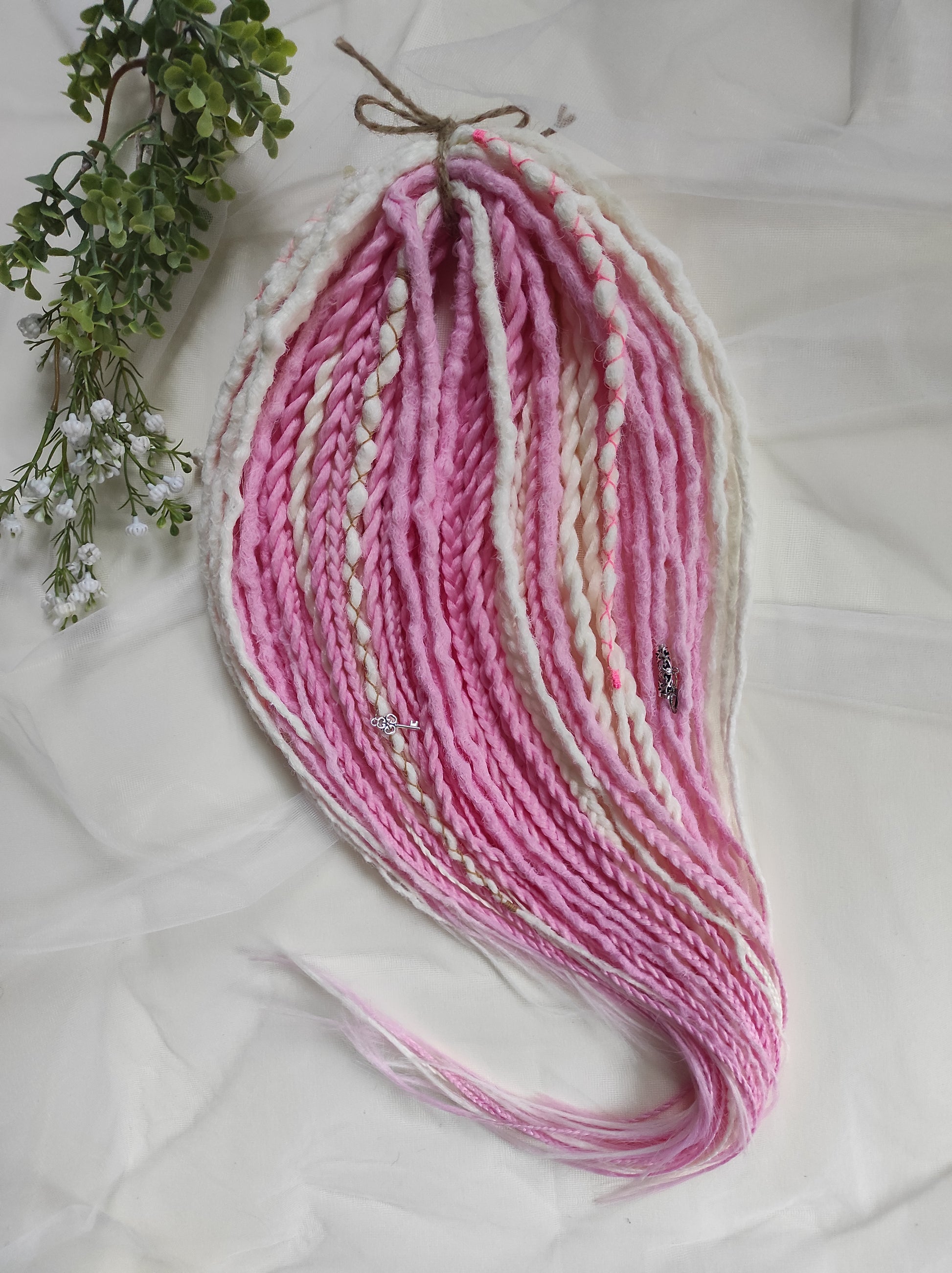 A soft blend of creamy white and gentle pink tones double ended crochet bumpy dreads, braids, and Senegalese twists. Decoration is included. Reusable lightweight set made from high-quality synthetic hypoallergenic material kanekalon.

Standard length: ±22-24 inches (55-60 cm)
Thickness of dreads and braids: ±0.8 cm