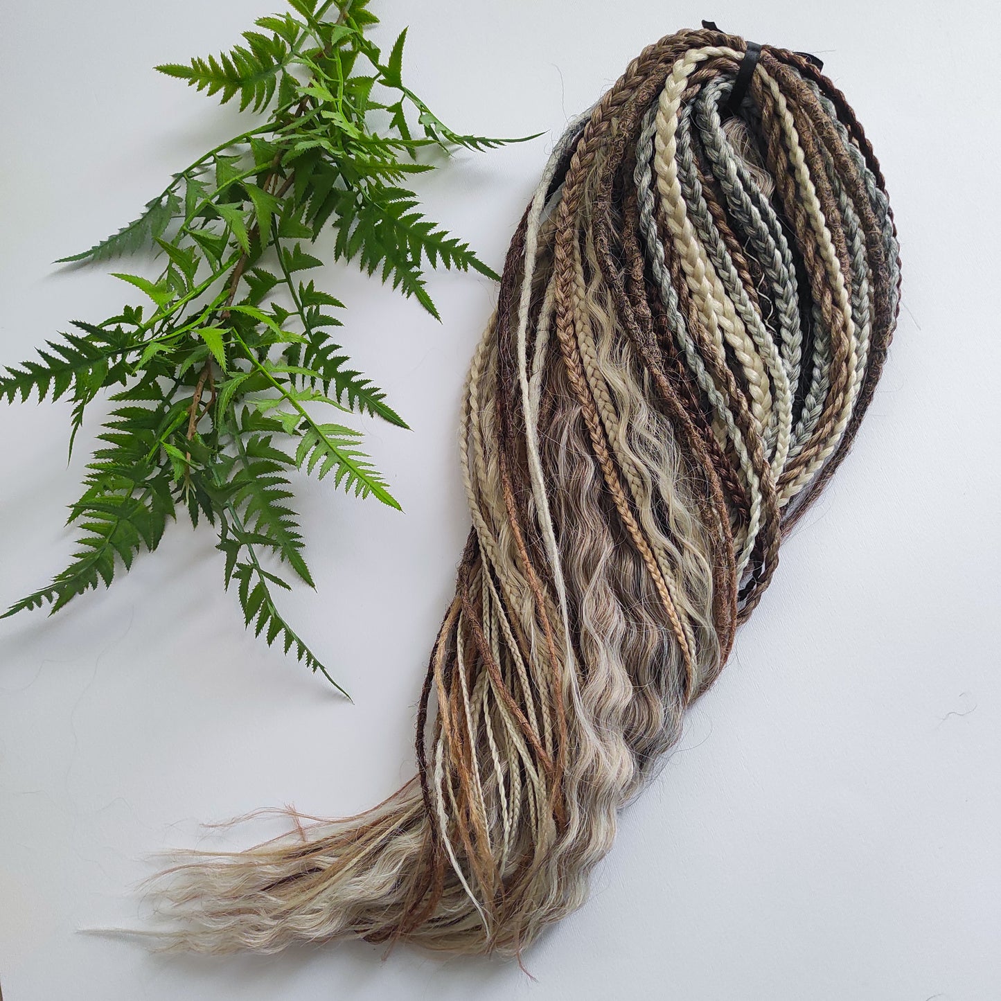 A mix of browns and ash blonde - lightweight,  reusable synthetic double ended crochet dreadlocks, non-brushable curls, braids, and Senegalese twists.

