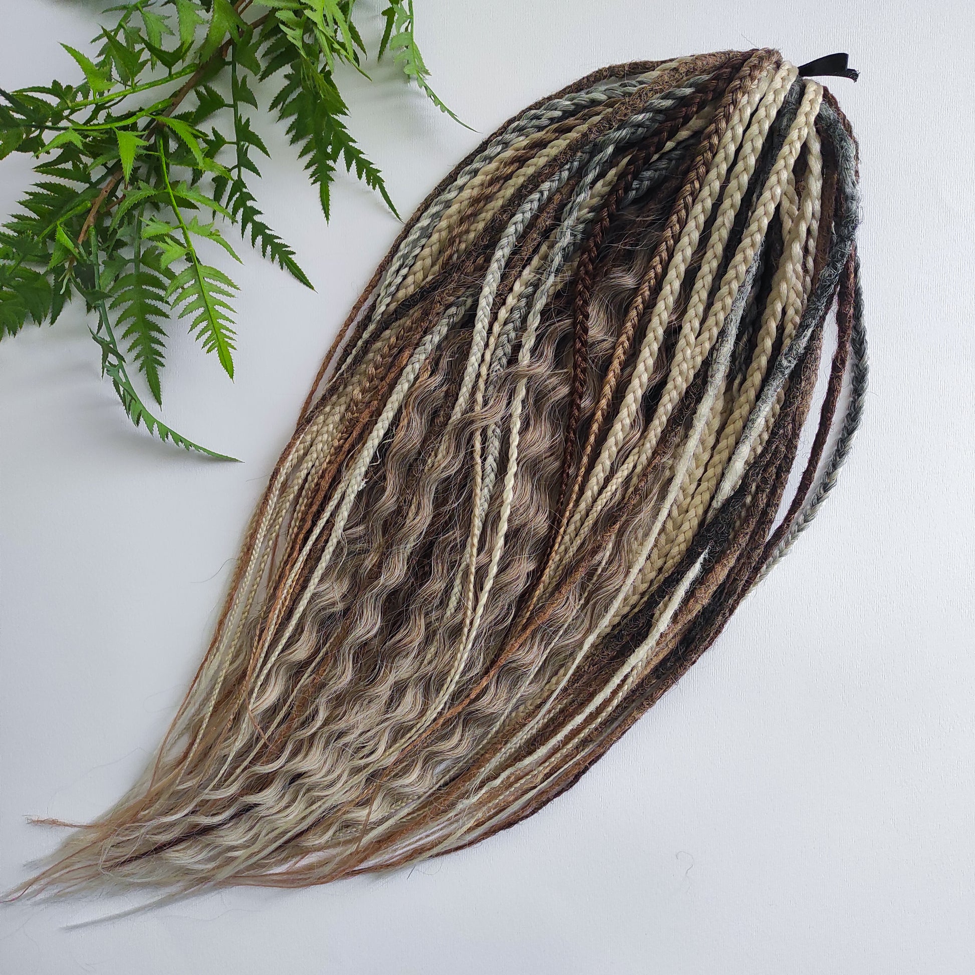 A mix of browns and ash blonde - lightweight,  reusable synthetic double ended crochet dreadlocks, non-brushable curls, braids, and Senegalese twists.
