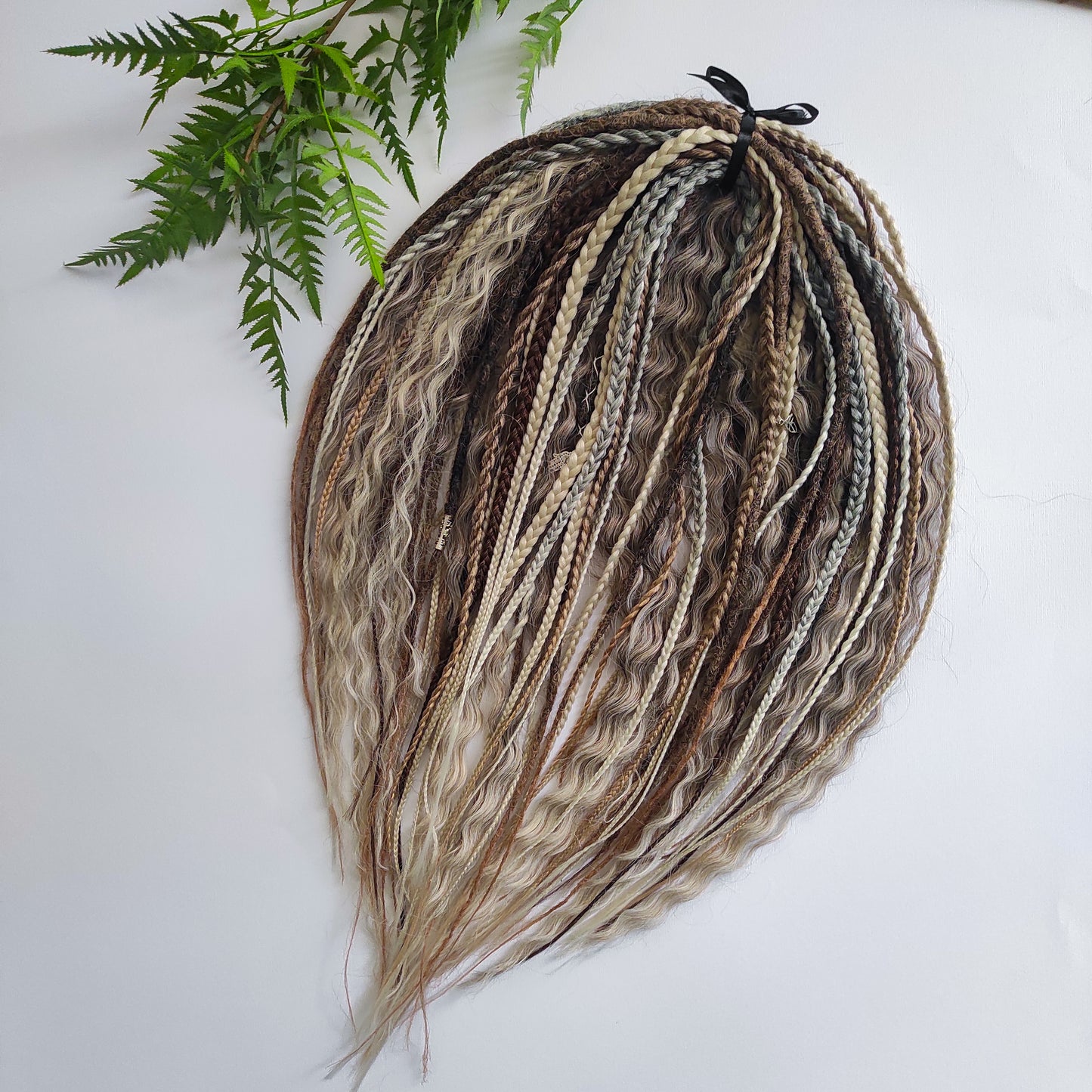 A mix of browns and ash blonde - lightweight,  reusable synthetic double ended crochet dreadlocks, non-brushable curls, braids, and Senegalese twists.

