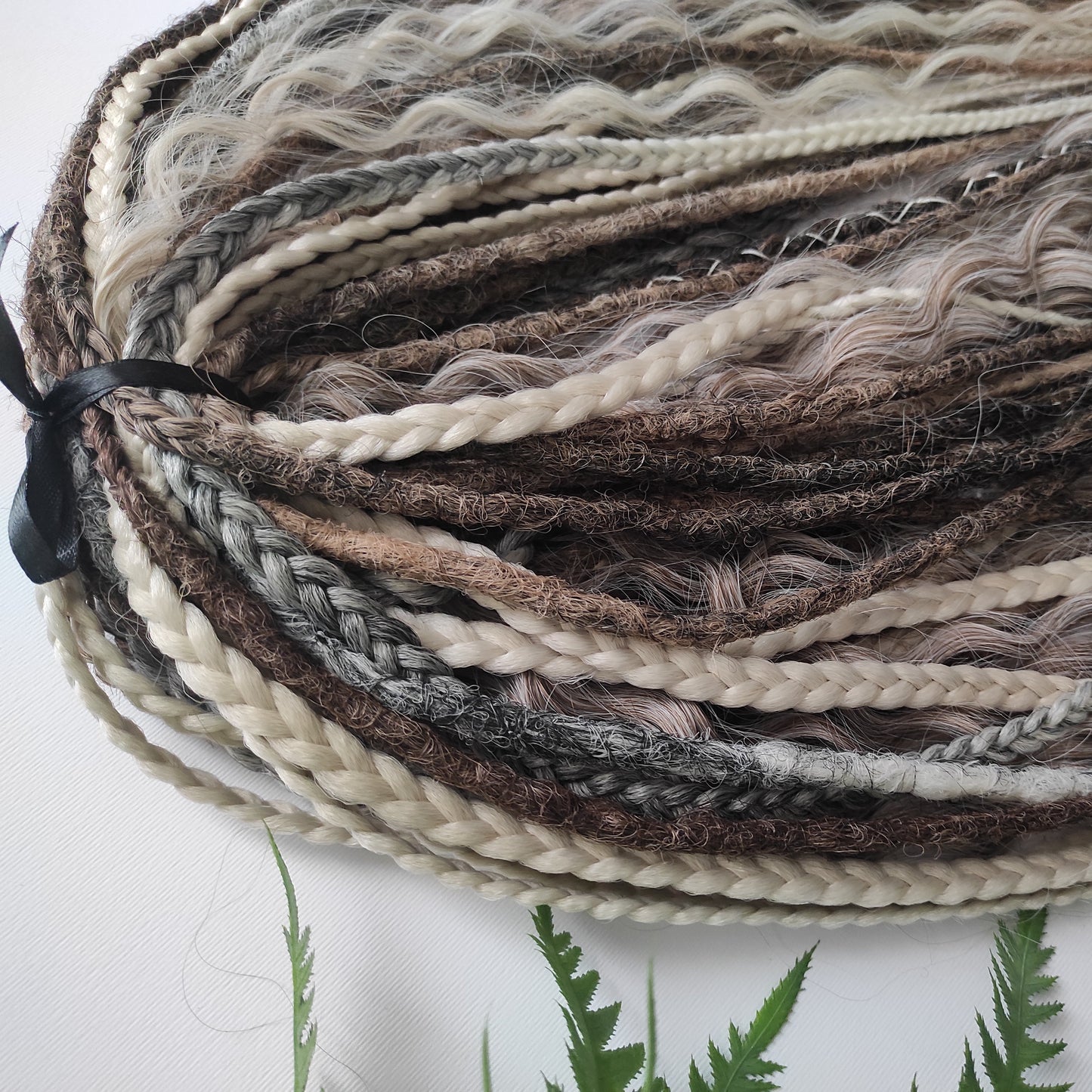 A mix of browns and ash blonde - lightweight,  reusable synthetic double ended crochet dreadlocks, non-brushable curls, braids, and Senegalese twists.
