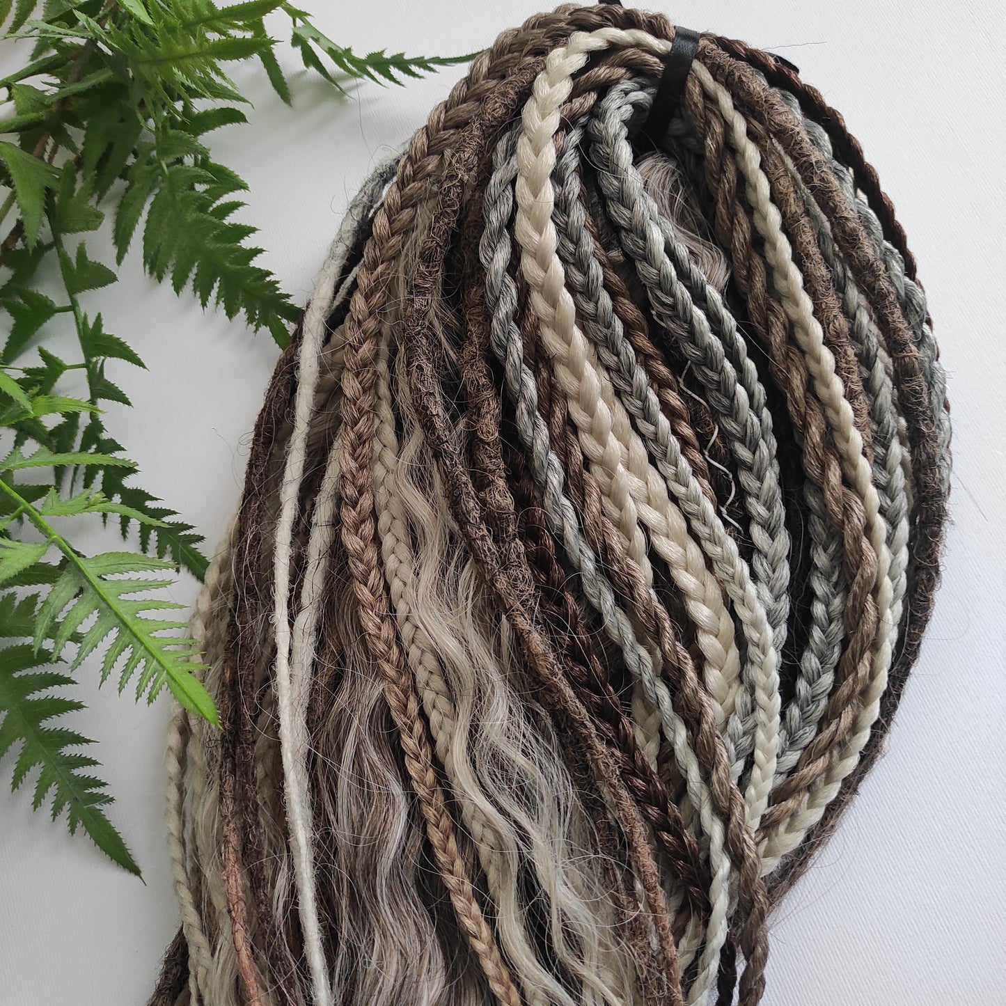 A mix of browns and ash blonde - lightweight,  reusable synthetic double ended crochet dreadlocks, non-brushable curls, braids, and Senegalese twists.
