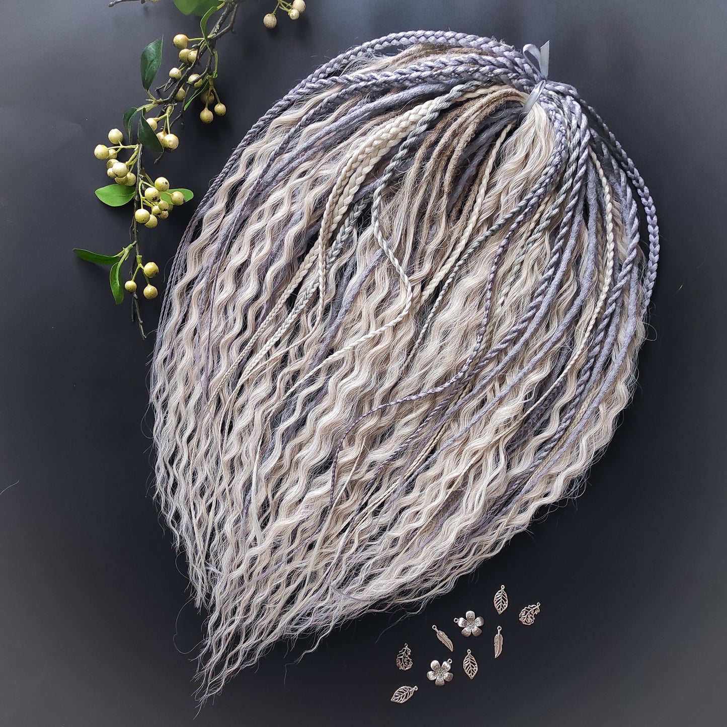 A mix of silver, grey and blonde - lightweight,  reusable synthetic double ended crochet dreadlocks, non-brushable dreaded curls, braids, and Senegalese twists.

Standard length: ±22-24 inches (55-60 cm)
Thickness of dreads and braids: ±0.8 cm
Dreaded part of curls ±10-12 cm (4-5 inches)