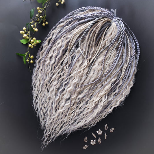 A mix of silver, grey and blonde - lightweight,  reusable synthetic double ended crochet dreadlocks, non-brushable dreaded curls, braids, and Senegalese twists.

Standard length: ±22-24 inches (55-60 cm)
Thickness of dreads and braids: ±0.8 cm
Dreaded part of curls ±10-12 cm (4-5 inches)