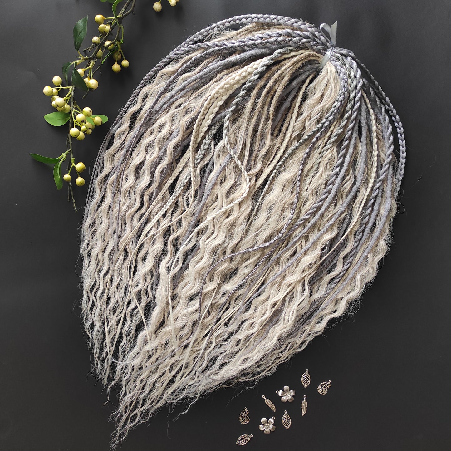 A mix of silver, grey and blonde - lightweight,  reusable synthetic double ended crochet dreadlocks, non-brushable dreaded curls, braids, and Senegalese twists.

Standard length: ±22-24 inches (55-60 cm)
Thickness of dreads and braids: ±0.8 cm
Dreaded part of curls ±10-12 cm (4-5 inches)