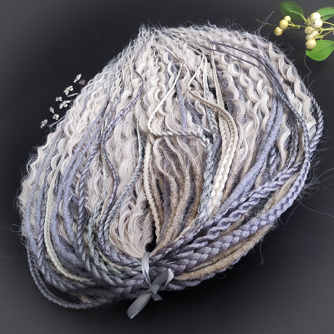A mix of silver, grey and blonde - lightweight,  reusable synthetic double ended crochet dreadlocks, non-brushable dreaded curls, braids, and Senegalese twists.

Standard length: ±22-24 inches (55-60 cm)
Thickness of dreads and braids: ±0.8 cm
Dreaded part of curls ±10-12 cm (4-5 inches)