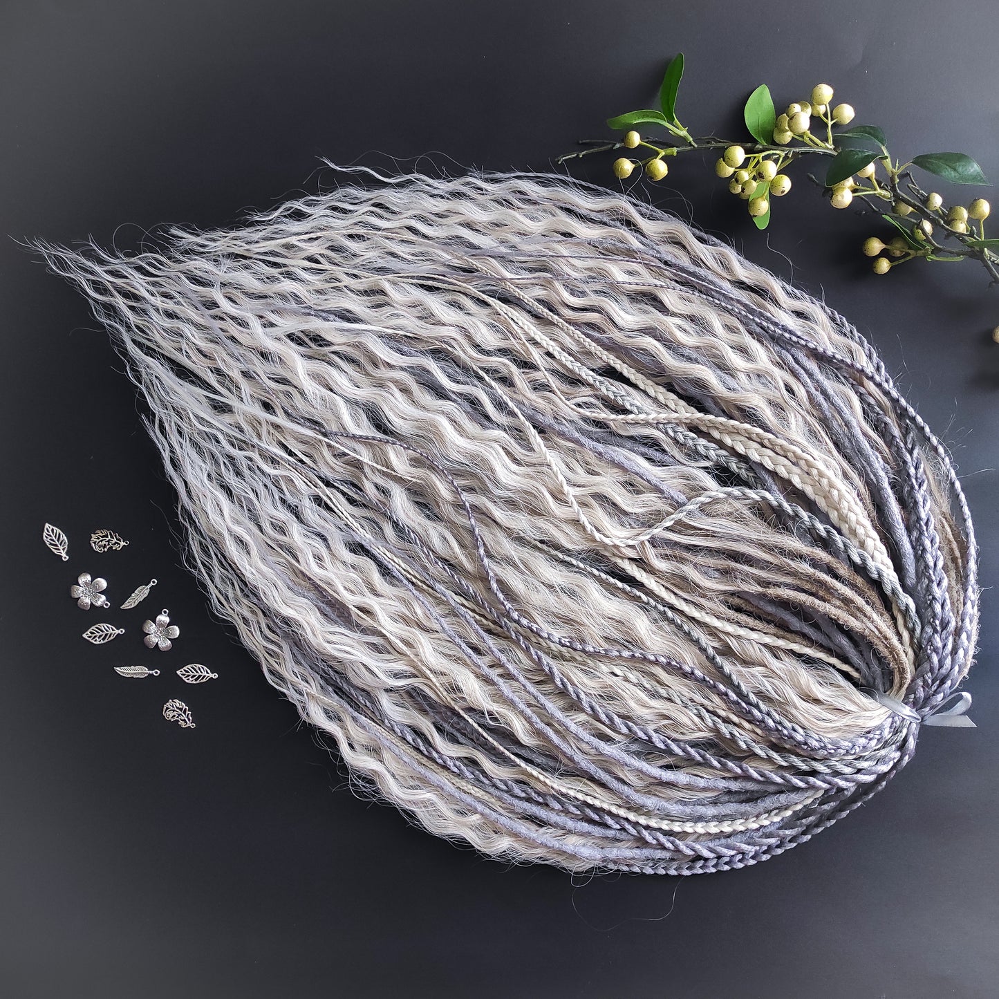 A mix of silver, grey and blonde - lightweight,  reusable synthetic double ended crochet dreadlocks, non-brushable dreaded curls, braids, and Senegalese twists.

Standard length: ±22-24 inches (55-60 cm)
Thickness of dreads and braids: ±0.8 cm
Dreaded part of curls ±10-12 cm (4-5 inches)