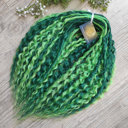 Emerald Moss - a mix of emerald and neon green. Soft, lightweight, and reusable synthetic double ended NON-BRUSHABLE curls.

The length:
Standard dreaded - 22-24 inches (55-60 cm), dreaded part ±4-5 inches
Push-up / Dolly - 20-22 inches (50-55 cm), dreaded part ±4 inches (from working side).
