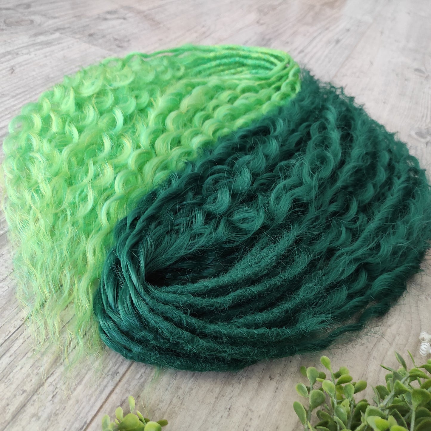 Emerald Moss - a mix of emerald and neon green. Soft, lightweight, and reusable synthetic double ended NON-BRUSHABLE curls.

The length:
Standard dreaded - 22-24 inches (55-60 cm), dreaded part ±4-5 inches
Push-up / Dolly - 20-22 inches (50-55 cm), dreaded part ±4 inches (from working side).
