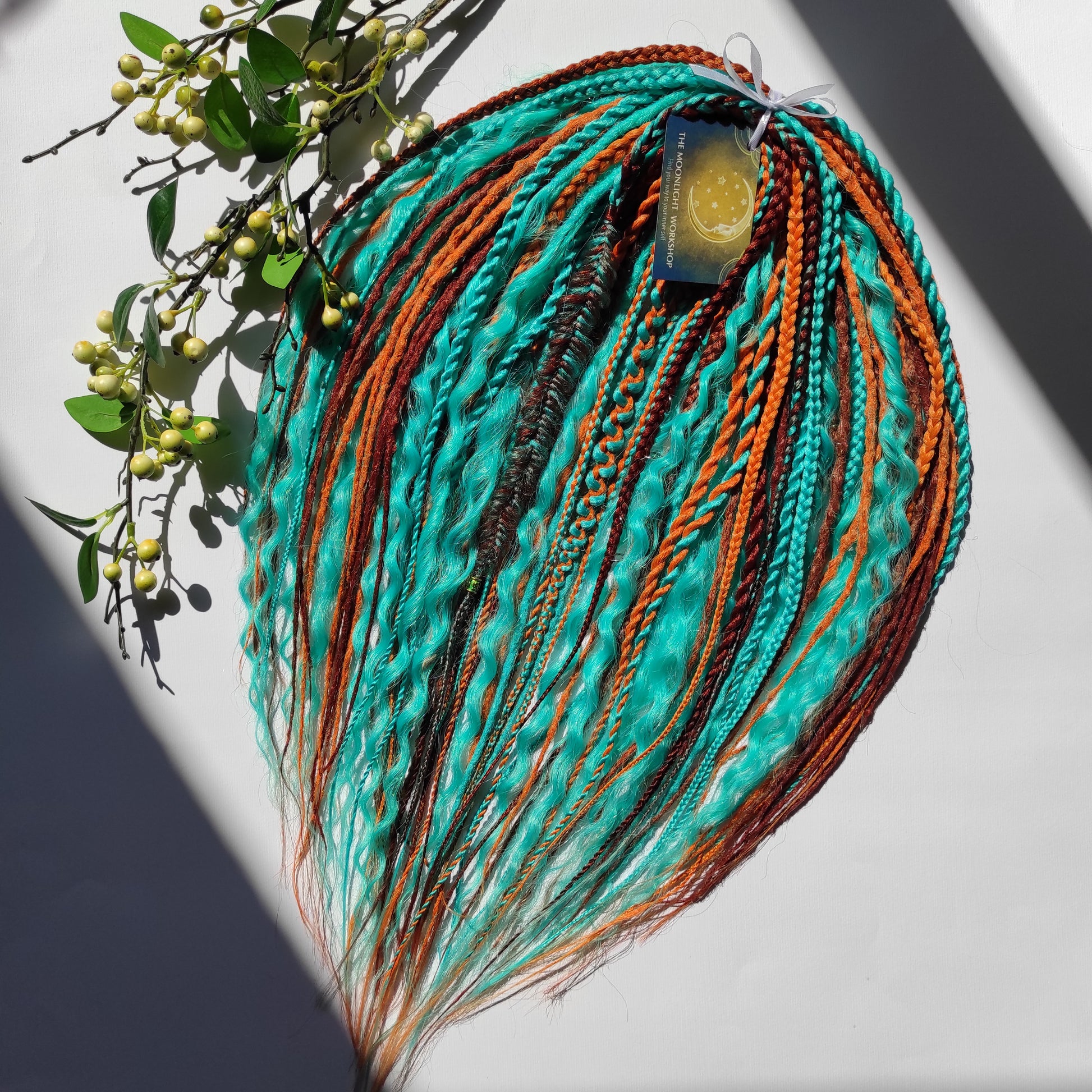 Ginger Sky: soft, lightweight, and reusable double ended synthetic dreads, braids, and regular dreaded non-brushable curls. A mix of turquoise green, red, copper, and orange colours.

The length is 22-24 inches (55-60 cm)
Dreaded part of curls: 3-4 inches
Thickness of dreads and braids ±0.8 cm