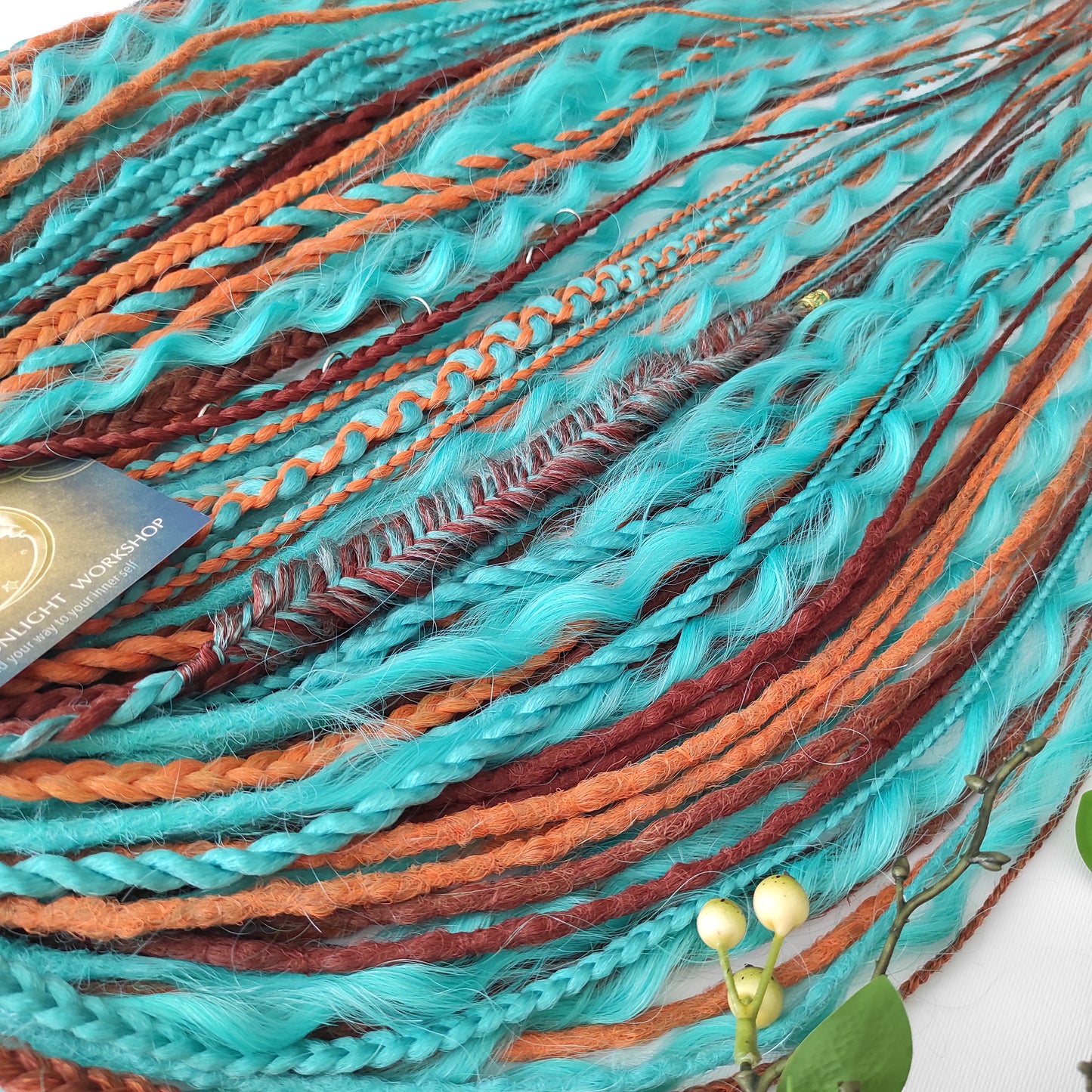 Ginger Sky: soft, lightweight, and reusable double ended synthetic dreads, braids, and regular dreaded non-brushable curls. A mix of turquoise green, red, copper, and orange colours.

The length is 22-24 inches (55-60 cm)
Dreaded part of curls: 3-4 inches
Thickness of dreads and braids ±0.8 cm