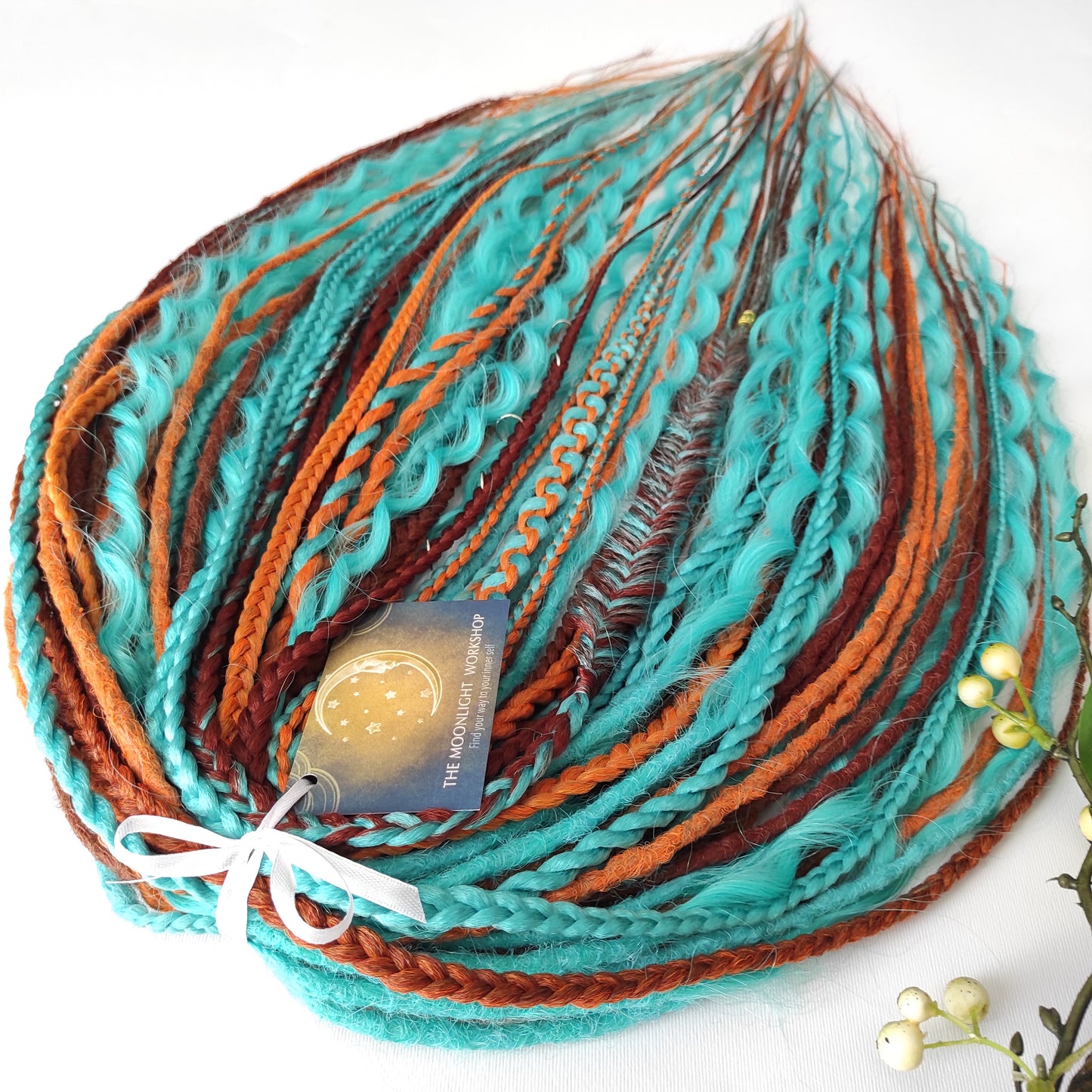 Ginger Sky: soft, lightweight, and reusable double ended synthetic dreads, braids, and regular dreaded non-brushable curls. A mix of turquoise green, red, copper, and orange colours.

The length is 22-24 inches (55-60 cm)
Dreaded part of curls: 3-4 inches
Thickness of dreads and braids ±0.8 cm