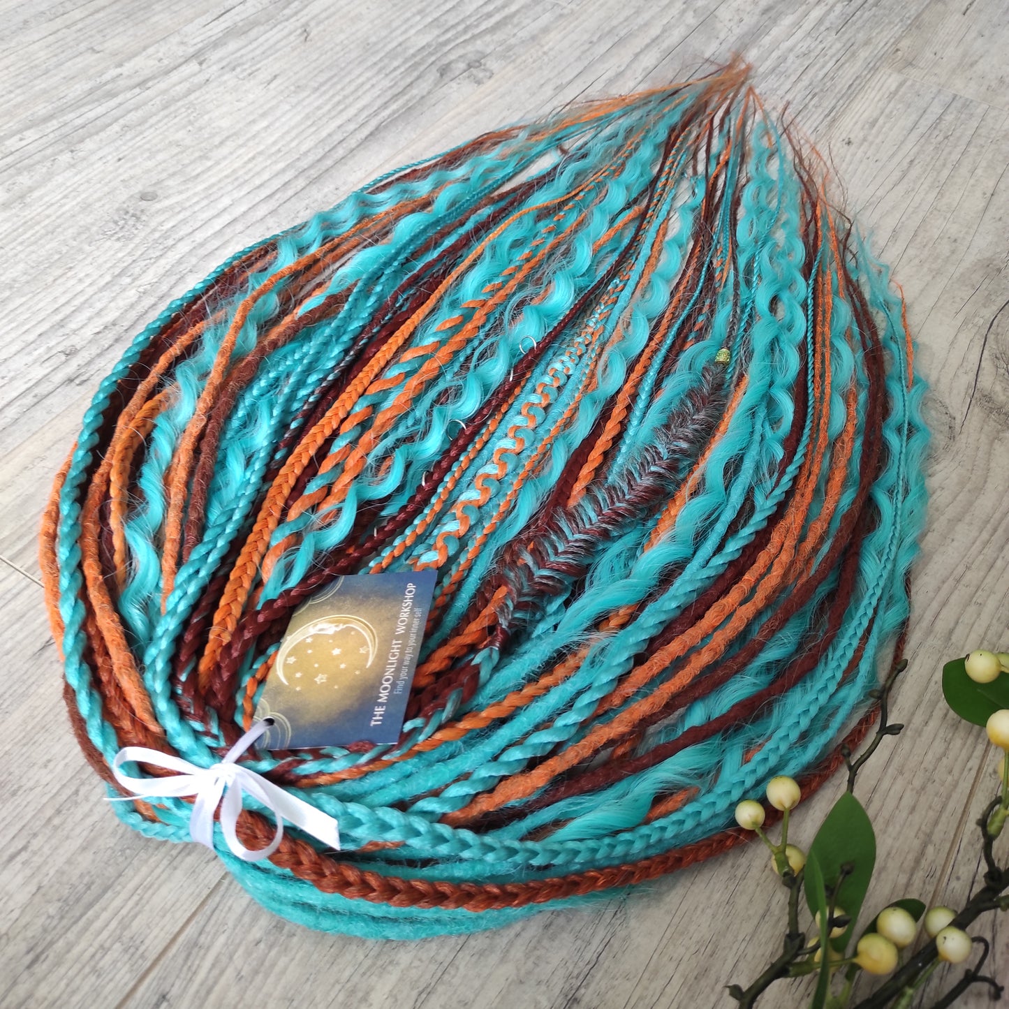 Ginger Sky: soft, lightweight, and reusable double ended synthetic dreads, braids, and regular dreaded non-brushable curls. A mix of turquoise green, red, copper, and orange colours.

The length is 22-24 inches (55-60 cm)
Dreaded part of curls: 3-4 inches
Thickness of dreads and braids ±0.8 cm