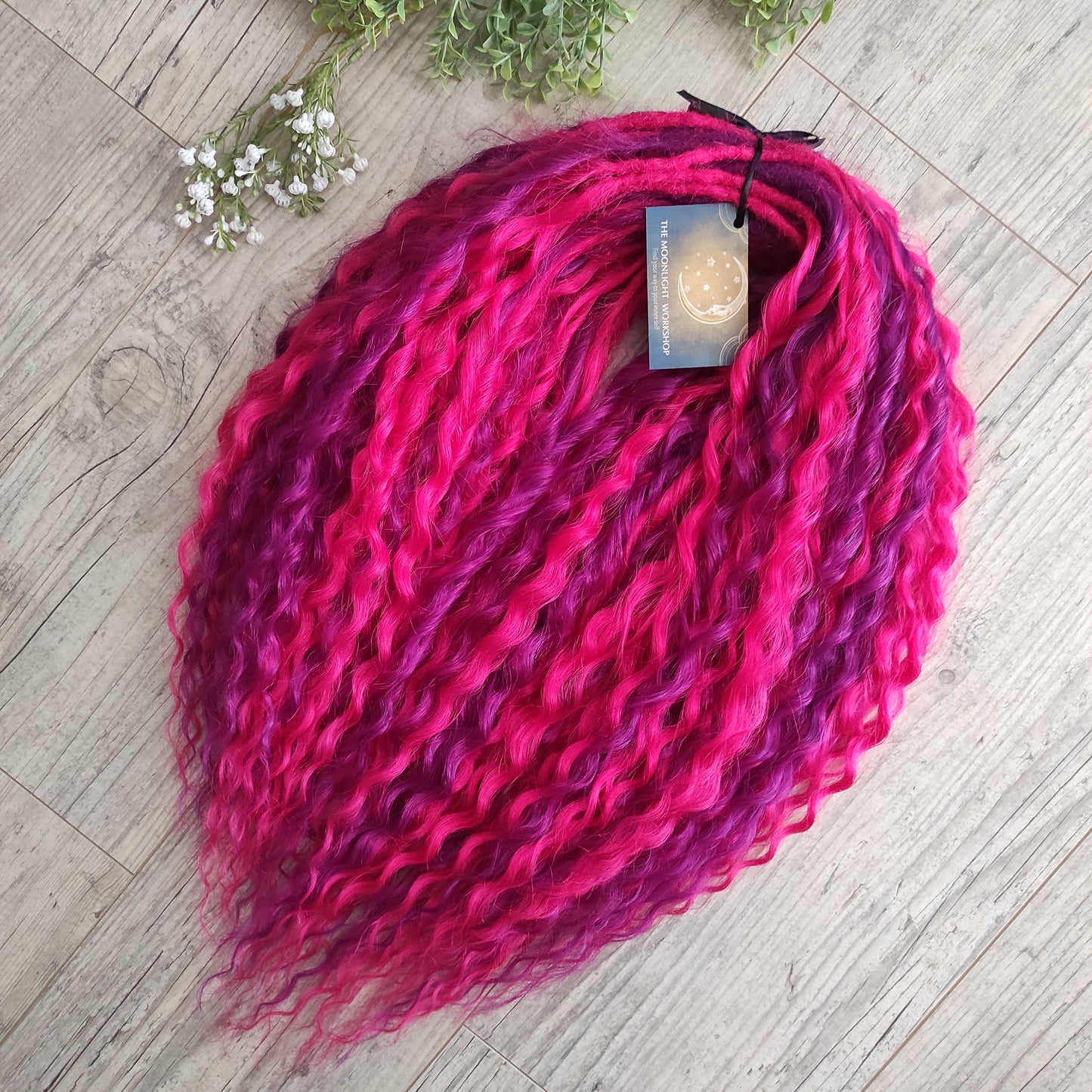 Neon Rose - soft, lightweight, and reusable synthetic set double ended regular curls (NON-BRUSHABLE) in hot fuchsia pink and magenta colours.

The length:
Standard dreaded - 22-24 inches (55-60 cm), dreaded part ±4-5 inches
Push-up / Dolly - 20-22 inches (50-55 cm), dreaded part ±4 inches (from working side).