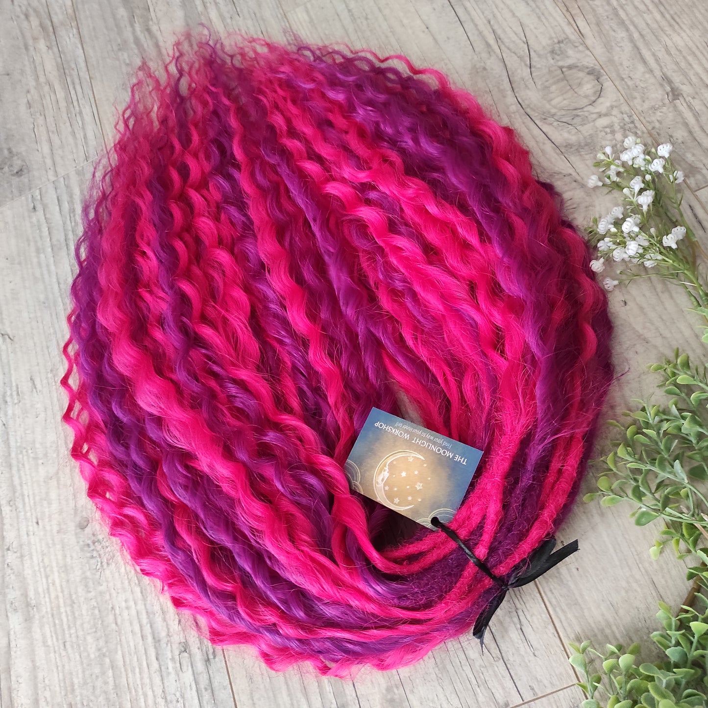 Neon Rose - soft, lightweight, and reusable synthetic set double ended regular curls (NON-BRUSHABLE) in hot fuchsia pink and magenta colours.

The length:
Standard dreaded - 22-24 inches (55-60 cm), dreaded part ±4-5 inches
Push-up / Dolly - 20-22 inches (50-55 cm), dreaded part ±4 inches (from working side).