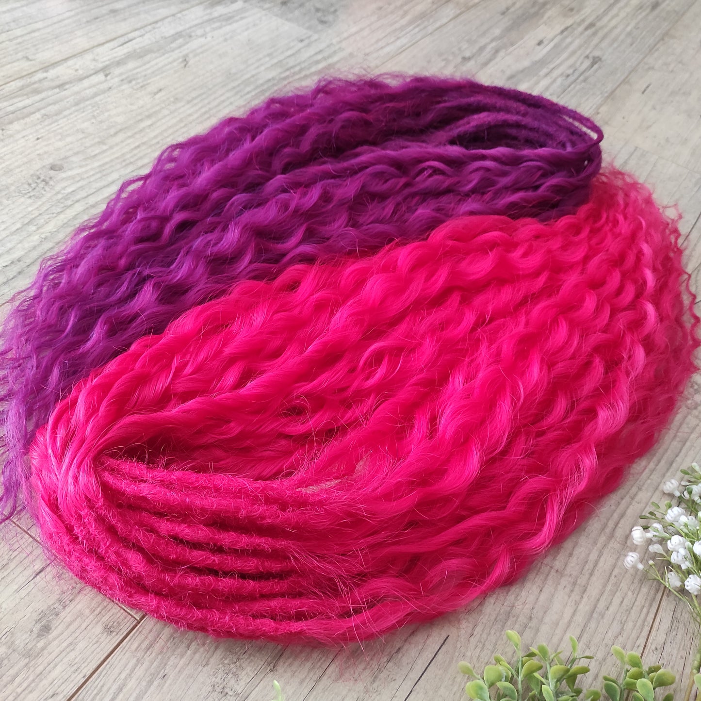 Neon Rose - soft, lightweight, and reusable synthetic set double ended regular curls (NON-BRUSHABLE) in hot fuchsia pink and magenta colours.

The length:
Standard dreaded - 22-24 inches (55-60 cm), dreaded part ±4-5 inches
Push-up / Dolly - 20-22 inches (50-55 cm), dreaded part ±4 inches (from working side).
