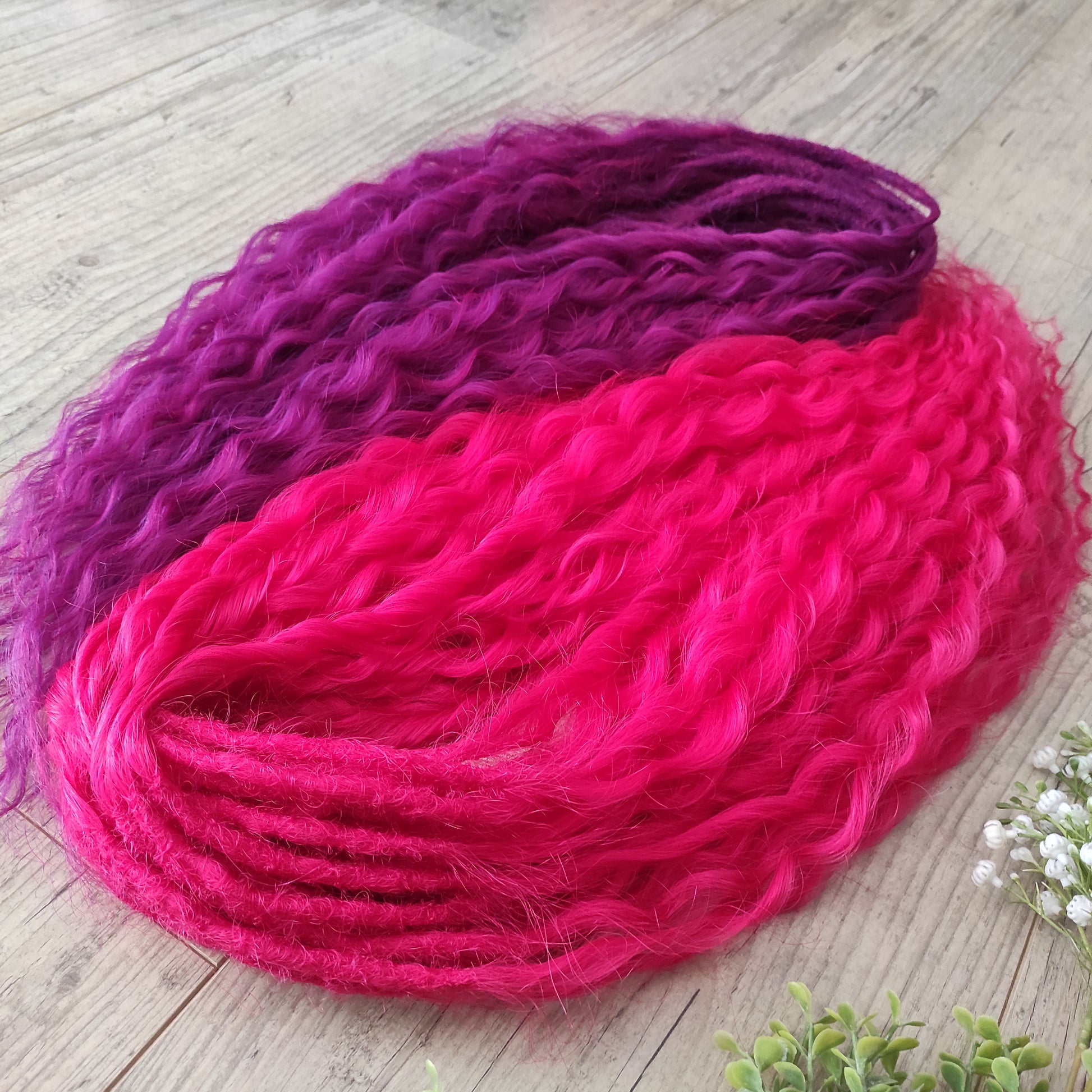 Neon Rose - soft, lightweight, and reusable synthetic set double ended regular curls (NON-BRUSHABLE) in hot fuchsia pink and magenta colours.

The length:
Standard dreaded - 22-24 inches (55-60 cm), dreaded part ±4-5 inches
Push-up / Dolly - 20-22 inches (50-55 cm), dreaded part ±4 inches (from working side).
