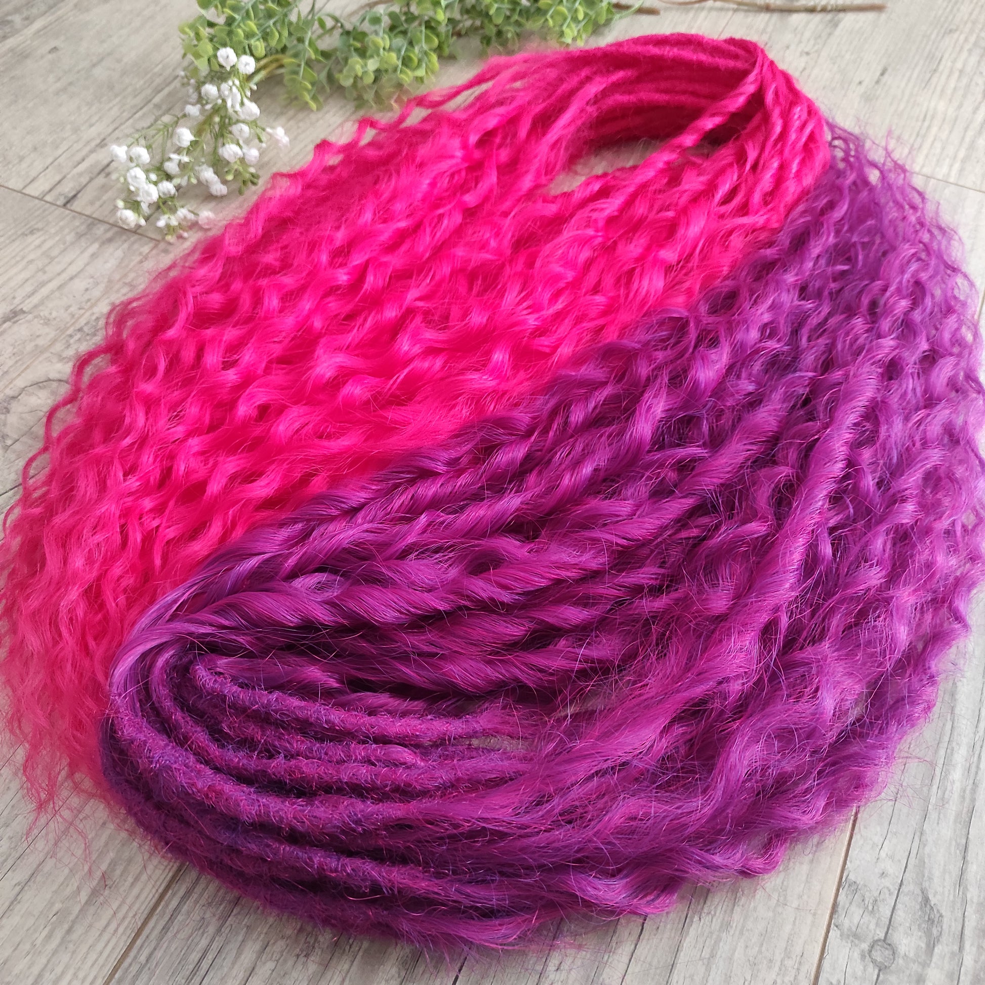 Neon Rose - soft, lightweight, and reusable synthetic set double ended regular curls (NON-BRUSHABLE) in hot fuchsia pink and magenta colours.

The length:
Standard dreaded - 22-24 inches (55-60 cm), dreaded part ±4-5 inches
Push-up / Dolly - 20-22 inches (50-55 cm), dreaded part ±4 inches (from working side).