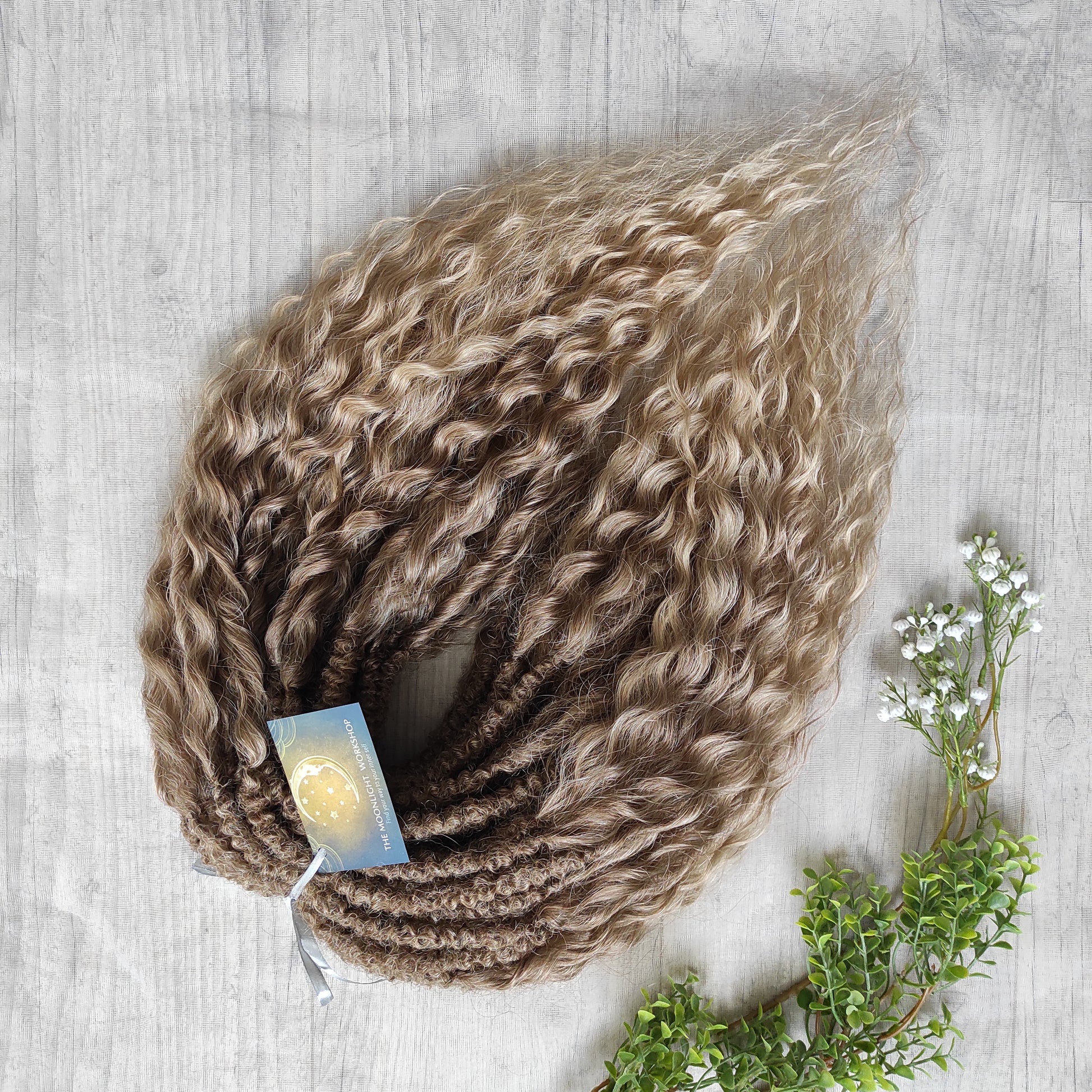 Ombre natural golden honey wheat blonde soft, lightweight, and reusable synthetic brushable double ended wavy dreadlocks (NOT BRUSHABLE).

The length:
Standard dreaded - 22-24 inches (55-60 cm), dreaded part ±3-4 inches
Push-up / Dolly - 20-22 inches (50-55 cm), dreaded part ±4 inches