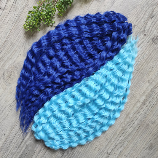 Soft, lightweight, and reusable synthetic sets of double ended regular curls (NOT BRUSHABLE) in blue shades:

1. sky blue;
2. deep blue;

The length:
Standard dreaded - 22-24 inches (55-60 cm), dreaded part `3-4 inches
Push-up / Dolly - 20-22 inches (50-55 cm), dreaded part `4 inches (from working side)