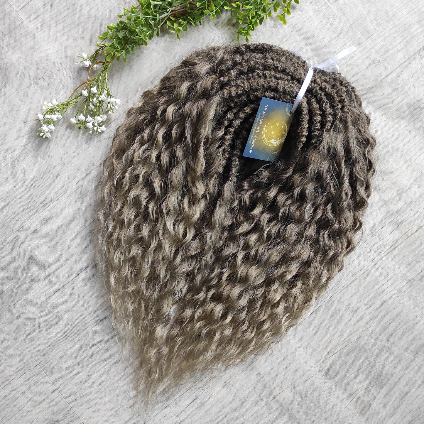 Ash ombre from light brown to wheat blonde (the color may look a bit different in different lighting). Soft, lightweight, and reusable synthetic brushable double ended wavy dreadlocks