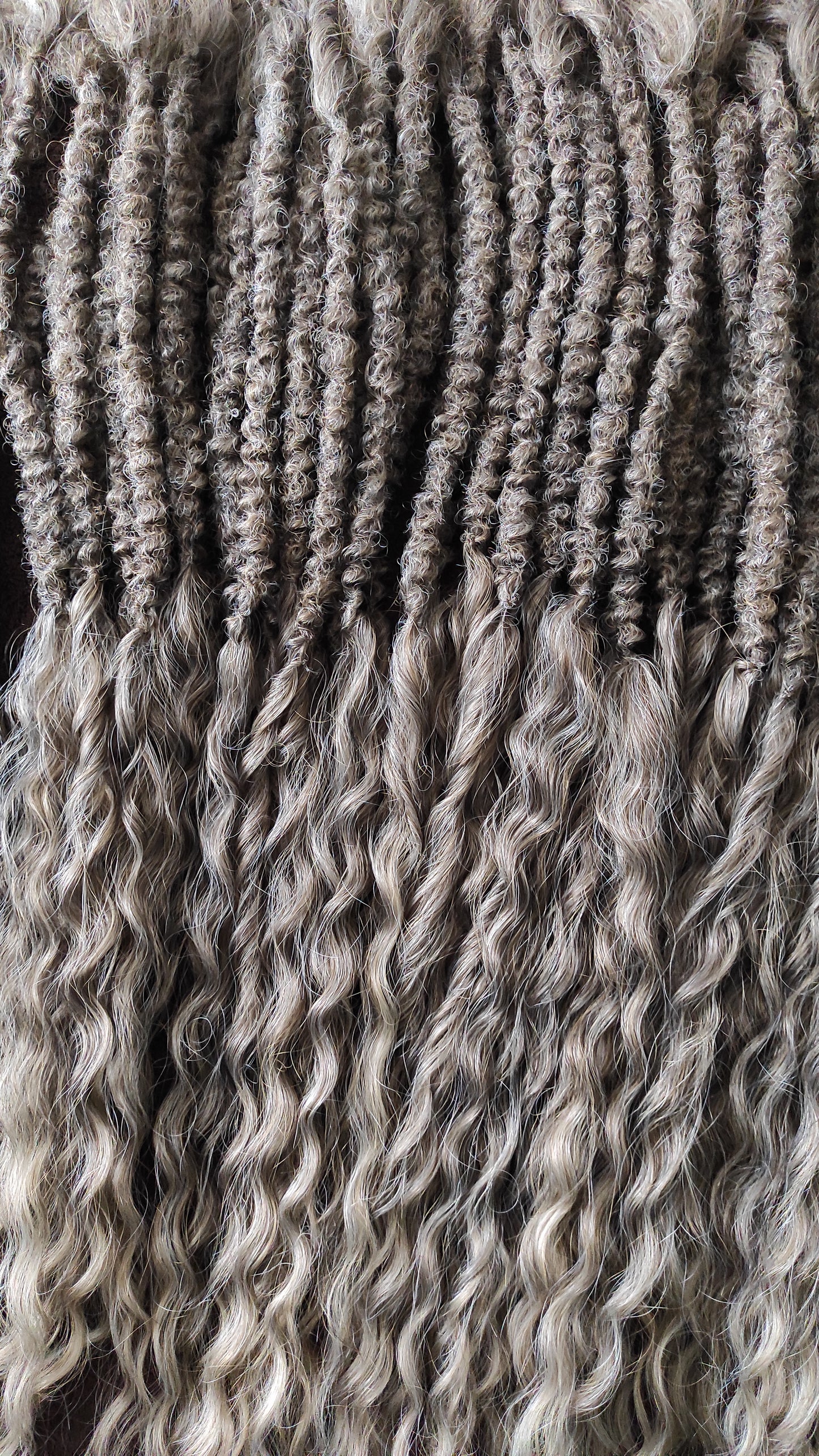 Ash ombre from light brown to wheat blonde (the color may look a bit different in different lighting). Soft, lightweight, and reusable synthetic brushable double ended wavy dreadlocks