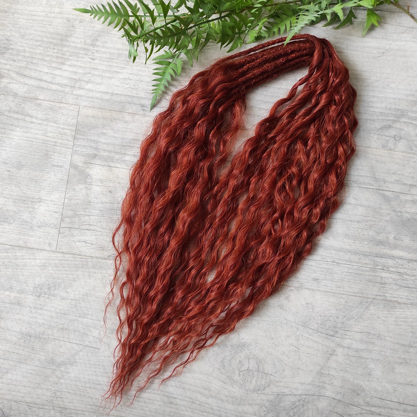 Soft, lightweight, and reusable synthetic sets of double ended regular curls (NOT BRUSHABLE) in red shades:

1. copper;
2. auburn/bronze;