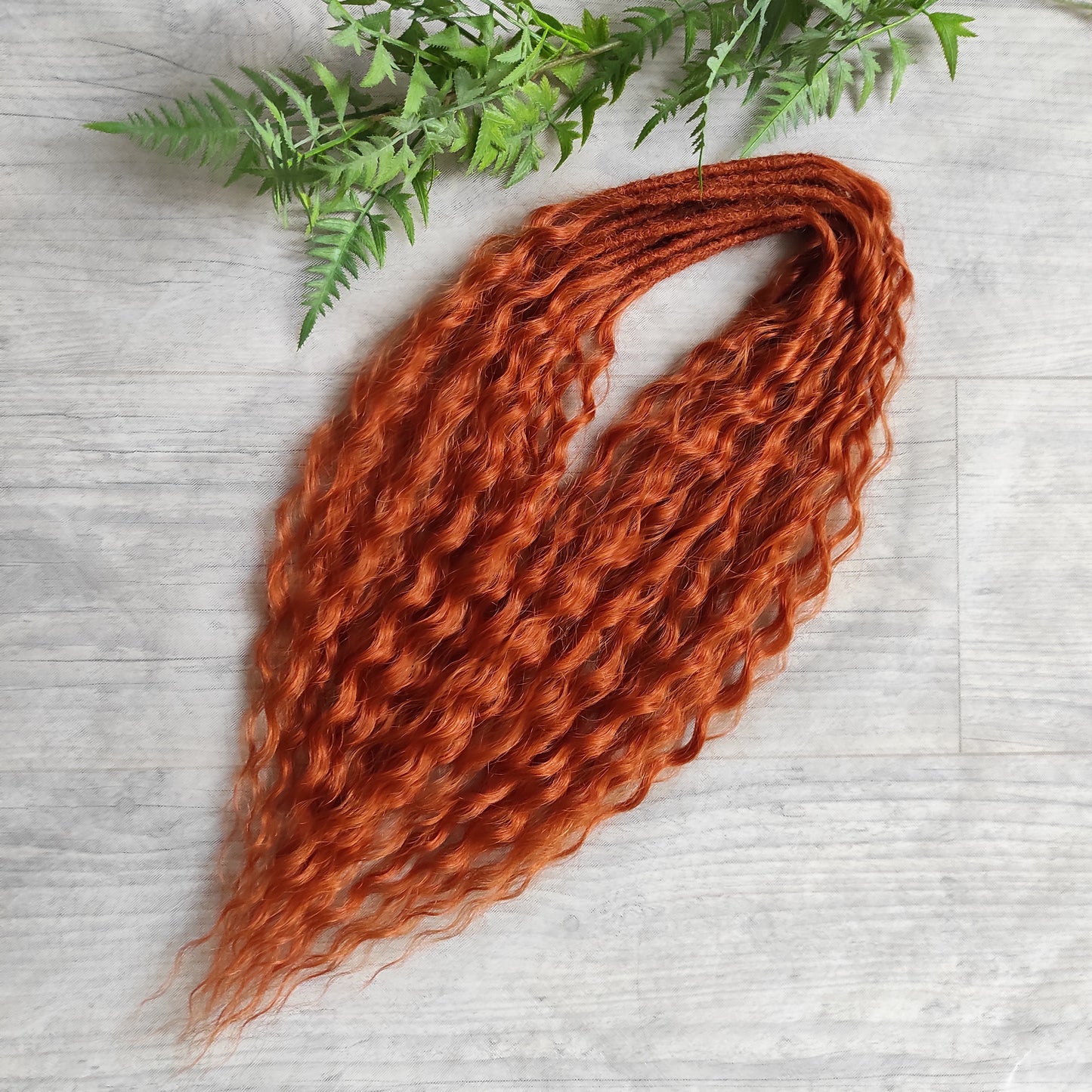 Soft, lightweight, and reusable synthetic sets of double ended regular curls (NOT BRUSHABLE) in red shades:

1. copper;
2. auburn/bronze;