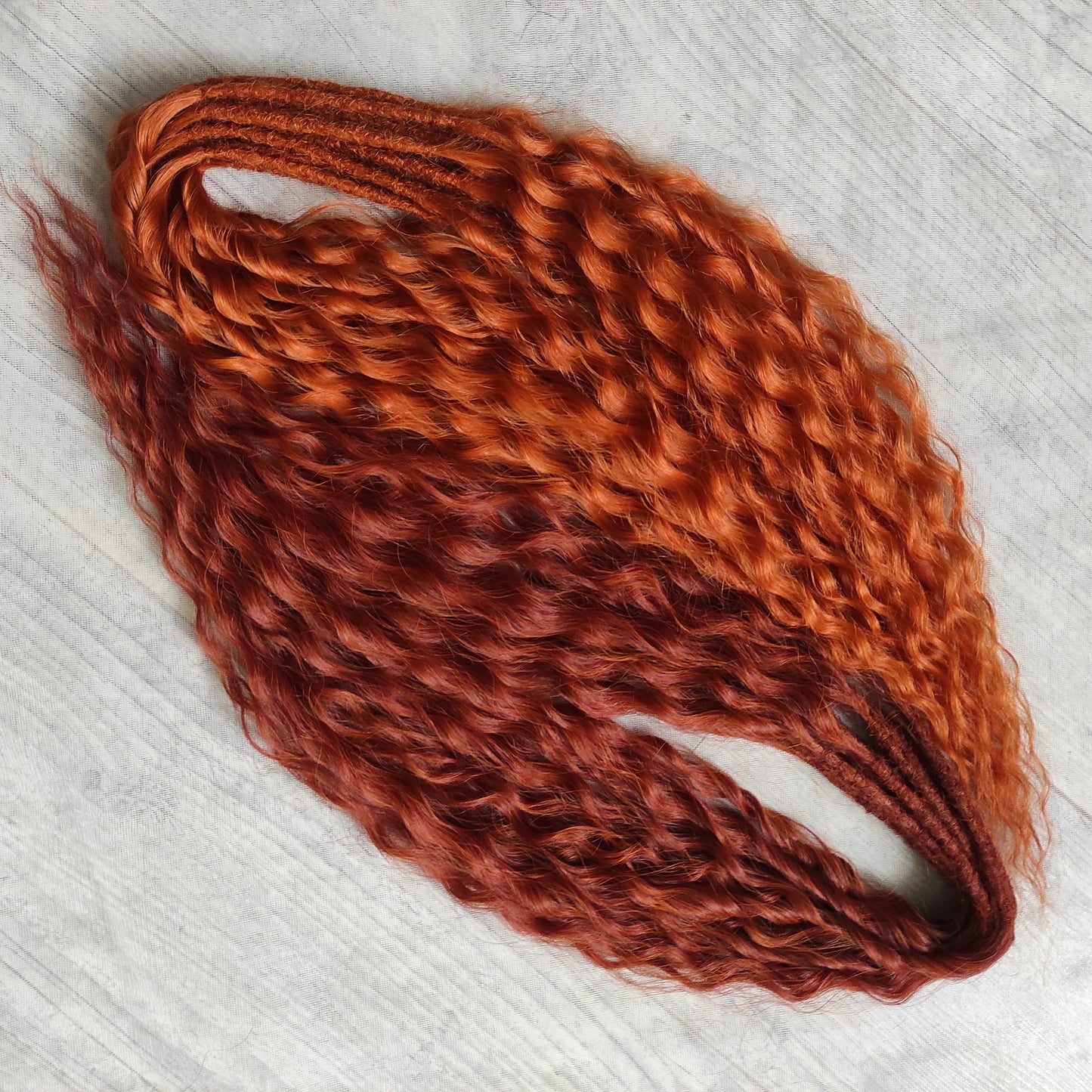 Soft, lightweight, and reusable synthetic sets of double ended regular curls (NOT BRUSHABLE) in red shades:

1. copper;
2. auburn/bronze;