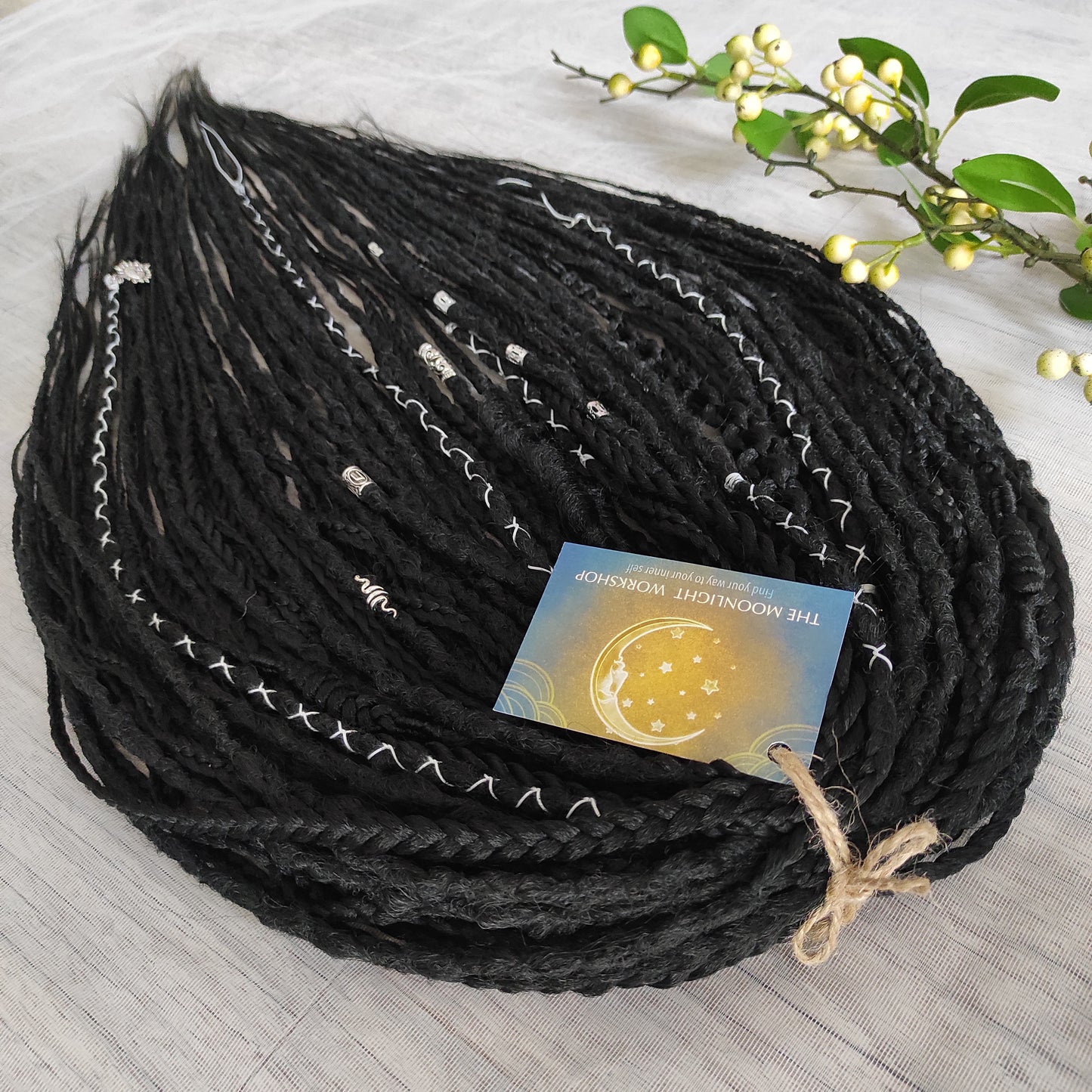 This set of synthetic dreadlocks combines elements of a Viking-inspired aesthetic.
Black double ended crochet dreads, braids, and Senegalese twists. Decoration is included. Reusable lightweight set made from high-quality synthetic hypoallergenic material kanekalon.

Standard length: ±22-24 inches (55-60 cm)
Thickness of dreads and braids: ±0.8 cm