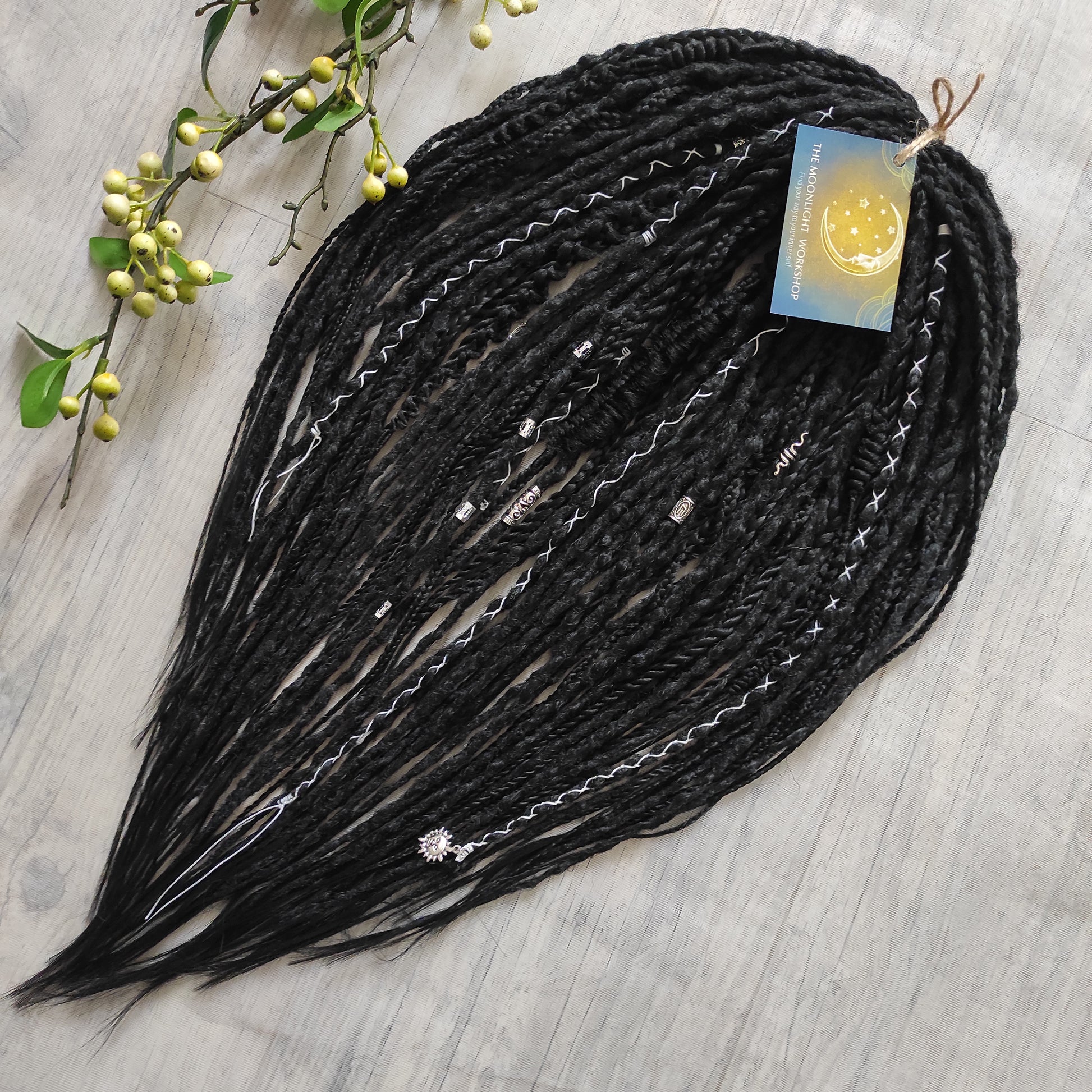 This set of synthetic dreadlocks combines elements of a Viking-inspired aesthetic.
Black double ended crochet dreads, braids, and Senegalese twists. Decoration is included. Reusable lightweight set made from high-quality synthetic hypoallergenic material kanekalon.

Standard length: ±22-24 inches (55-60 cm)
Thickness of dreads and braids: ±0.8 cm