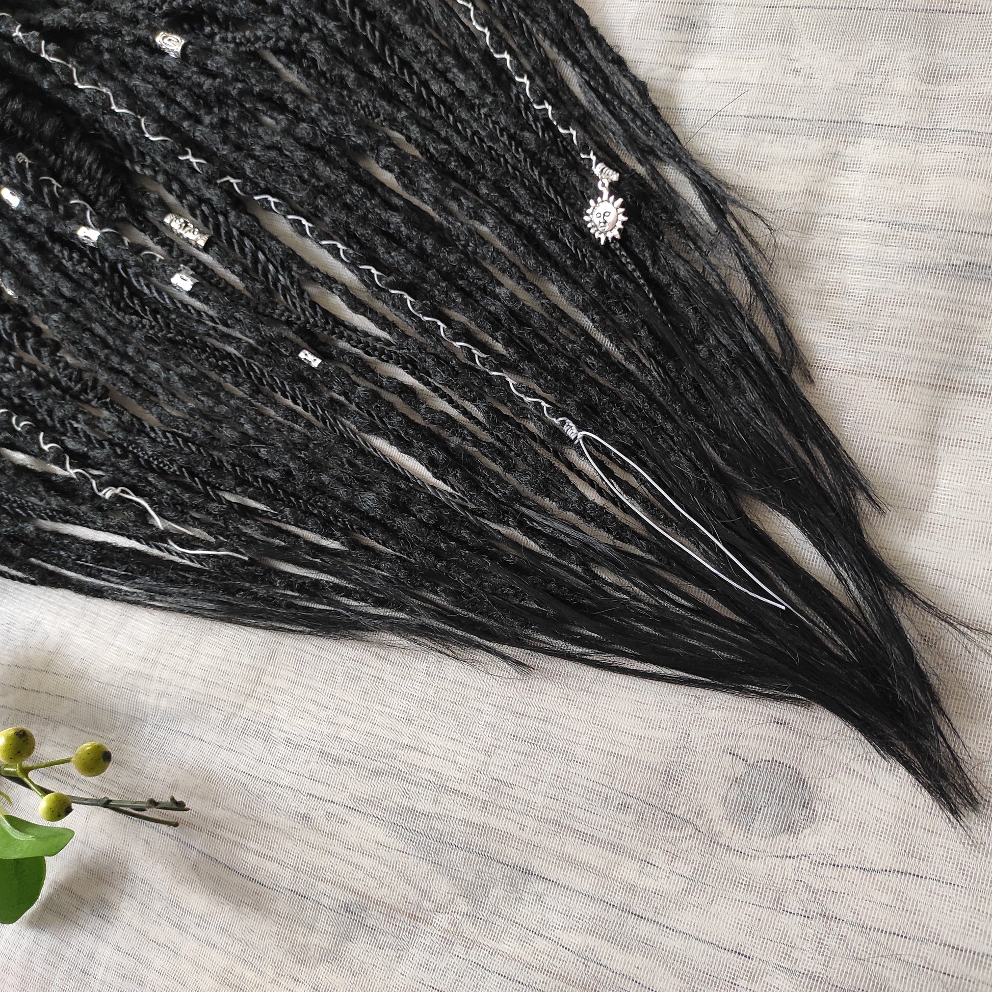 This set of synthetic dreadlocks combines elements of a Viking-inspired aesthetic.
Black double ended crochet dreads, braids, and Senegalese twists. Decoration is included. Reusable lightweight set made from high-quality synthetic hypoallergenic material kanekalon.

Standard length: ±22-24 inches (55-60 cm)
Thickness of dreads and braids: ±0.8 cm