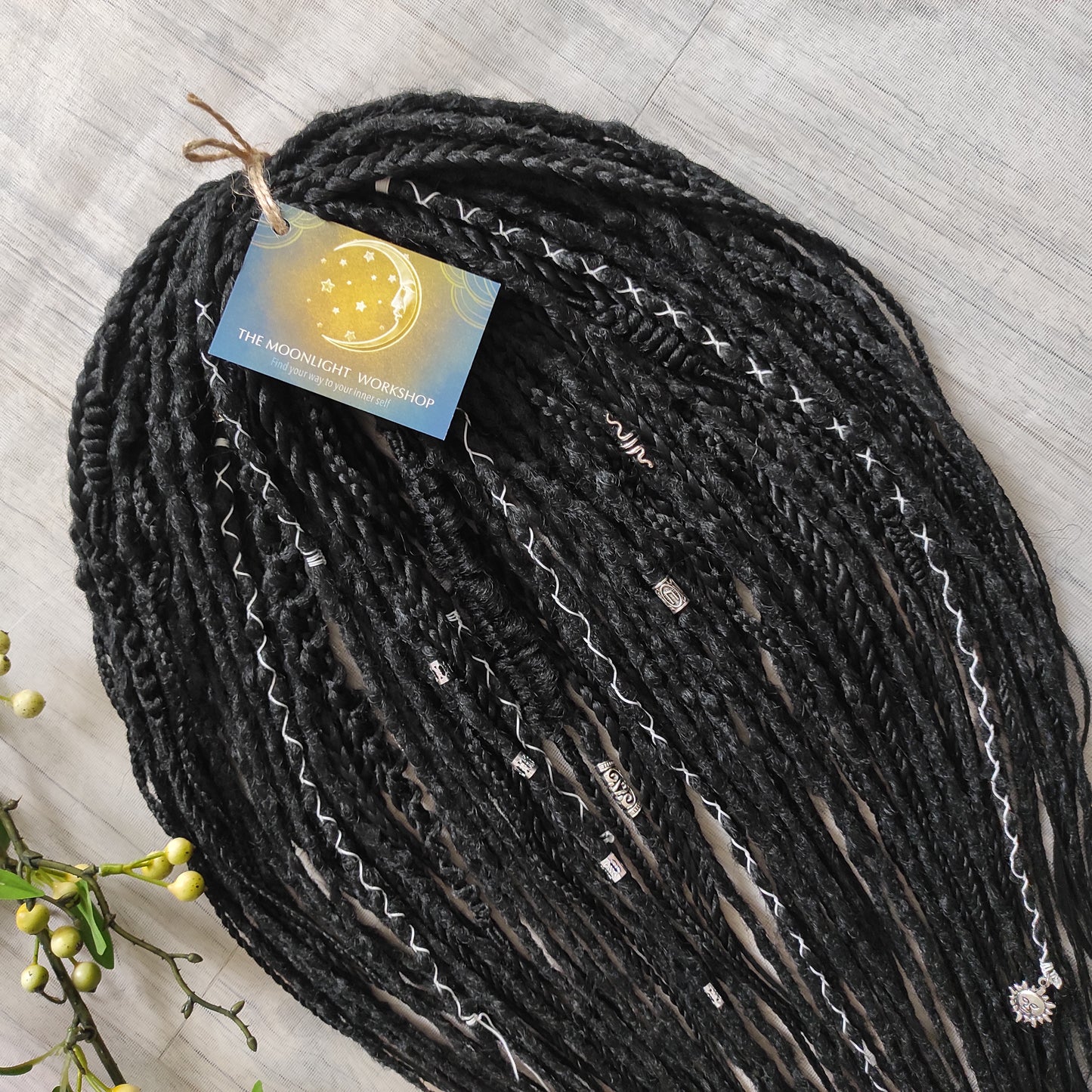 This set of synthetic dreadlocks combines elements of a Viking-inspired aesthetic.
Black double ended crochet dreads, braids, and Senegalese twists. Decoration is included. Reusable lightweight set made from high-quality synthetic hypoallergenic material kanekalon.

Standard length: ±22-24 inches (55-60 cm)
Thickness of dreads and braids: ±0.8 cm