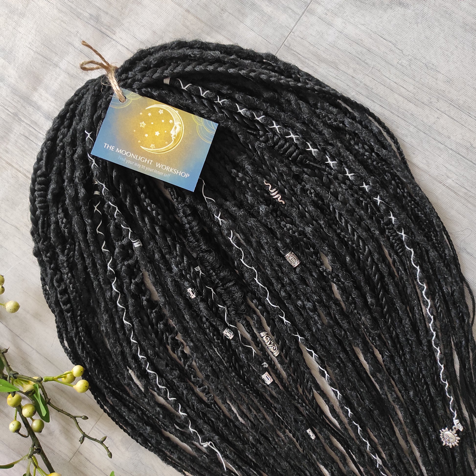 This set of synthetic dreadlocks combines elements of a Viking-inspired aesthetic.
Black double ended crochet dreads, braids, and Senegalese twists. Decoration is included. Reusable lightweight set made from high-quality synthetic hypoallergenic material kanekalon.

Standard length: ±22-24 inches (55-60 cm)
Thickness of dreads and braids: ±0.8 cm