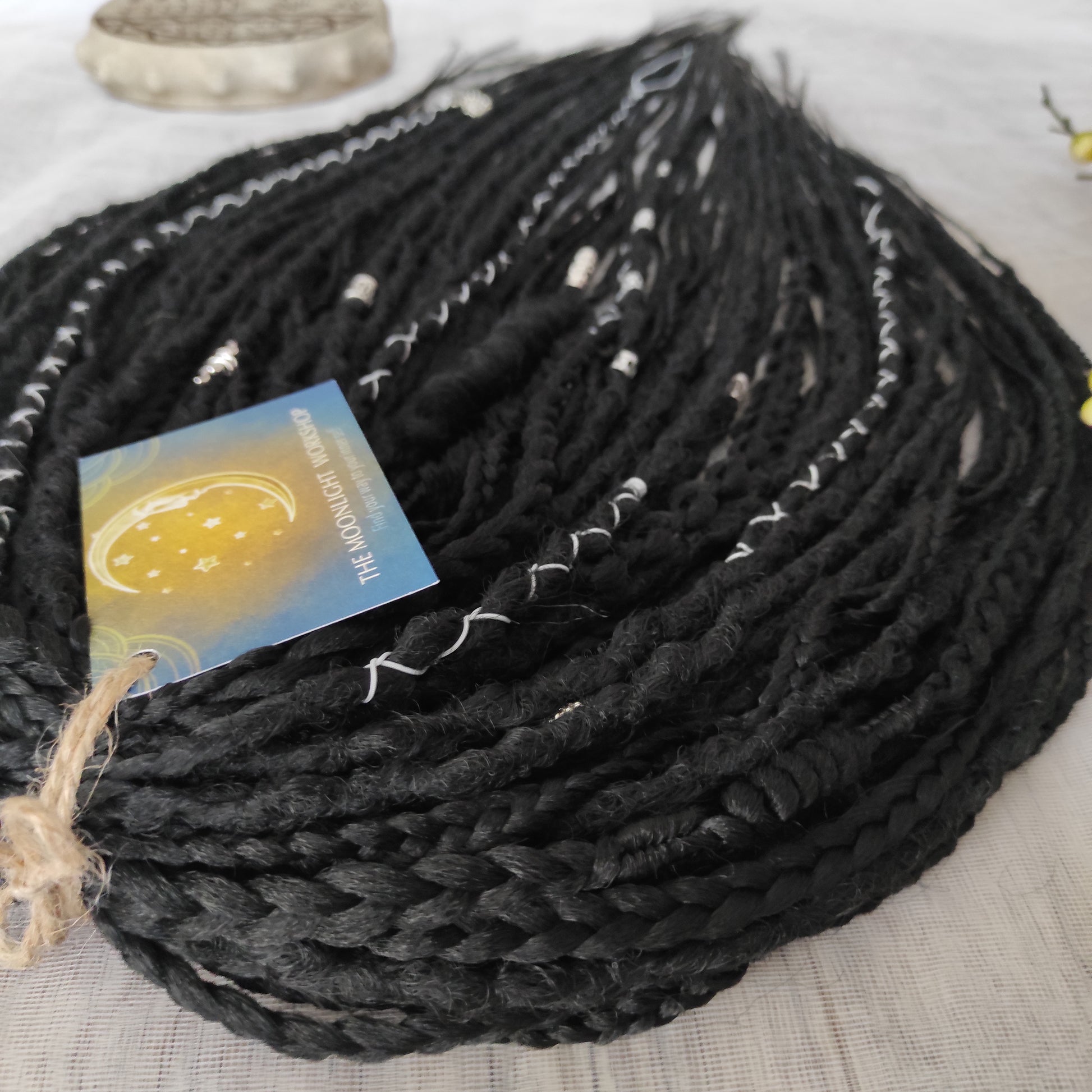 This set of synthetic dreadlocks combines elements of a Viking-inspired aesthetic.
Black double ended crochet dreads, braids, and Senegalese twists. Decoration is included. Reusable lightweight set made from high-quality synthetic hypoallergenic material kanekalon.

Standard length: ±22-24 inches (55-60 cm)
Thickness of dreads and braids: ±0.8 cm
