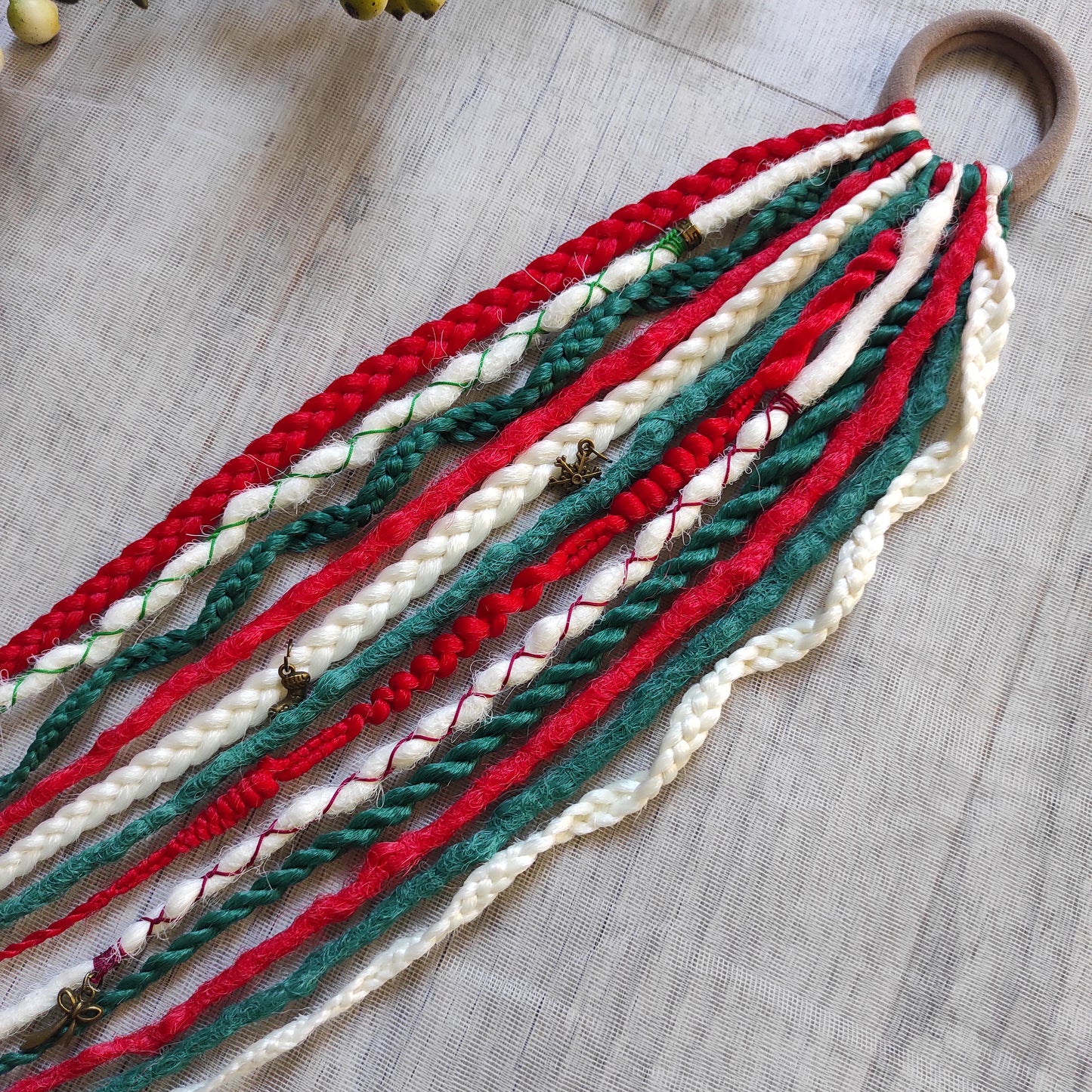 Braids, dreads, and curls on an elastic band — a simple way to transform a ponytail without installing a set. Easy to put on and remove whenever you like. A great option if you can’t install dreads or braids. Also, a perfect gift for kids 🎁

These scrunchies add instant length, volume, and texture — whether you prefer bold colors or natural shades.

Length: 22–24 inches.
Each hair tie includes 12–14 pieces, depending on the style.

Choose from the available designs shown, or contact us for a custom order.