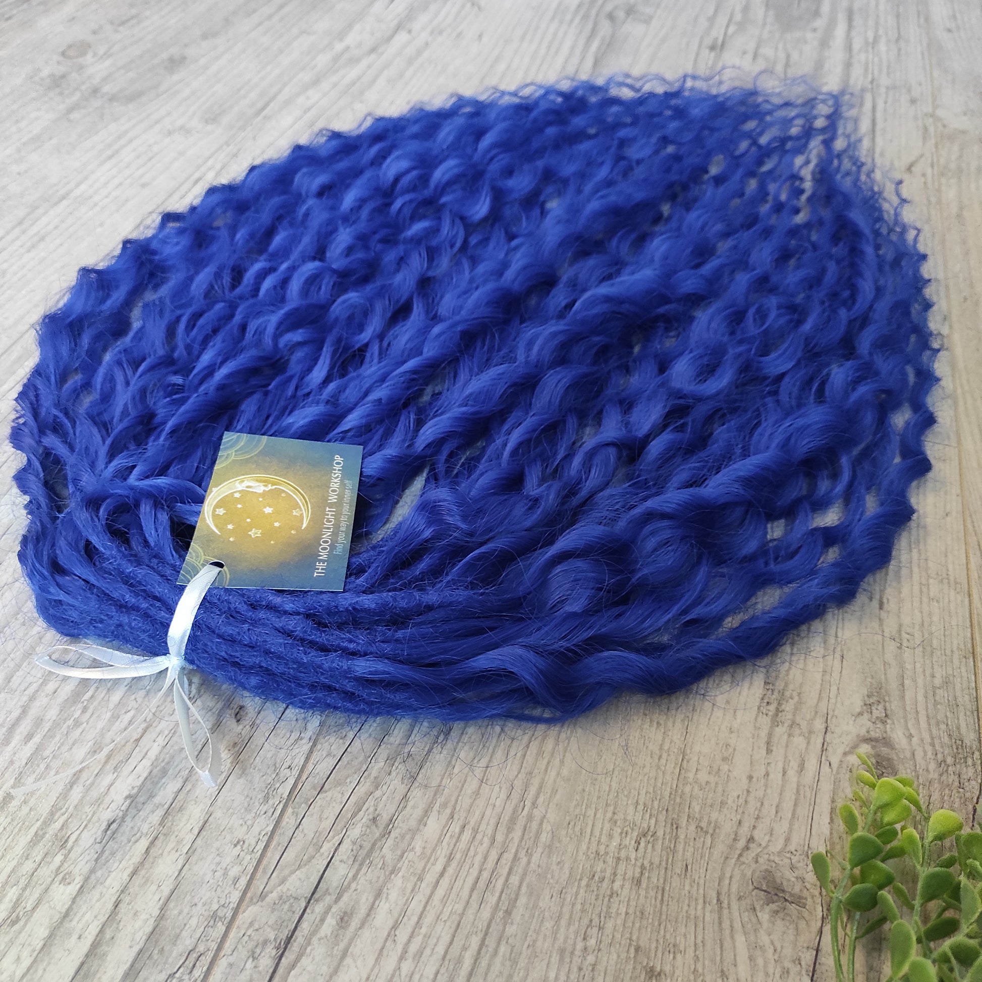 Soft, lightweight, and reusable synthetic sets of double ended regular curls (NOT BRUSHABLE) in blue shades:

1. sky blue;
2. deep blue;

The length:
Standard dreaded - 22-24 inches (55-60 cm), dreaded part `3-4 inches
Push-up / Dolly - 20-22 inches (50-55 cm), dreaded part `4 inches (from working side)