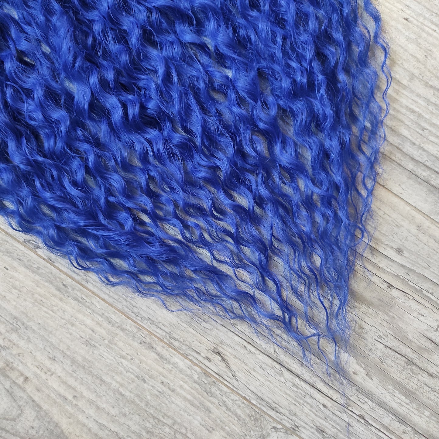 Soft, lightweight, and reusable synthetic sets of double ended regular curls (NOT BRUSHABLE) in blue shades:

1. sky blue;
2. deep blue;

The length:
Standard dreaded - 22-24 inches (55-60 cm), dreaded part `3-4 inches
Push-up / Dolly - 20-22 inches (50-55 cm), dreaded part `4 inches (from working side)