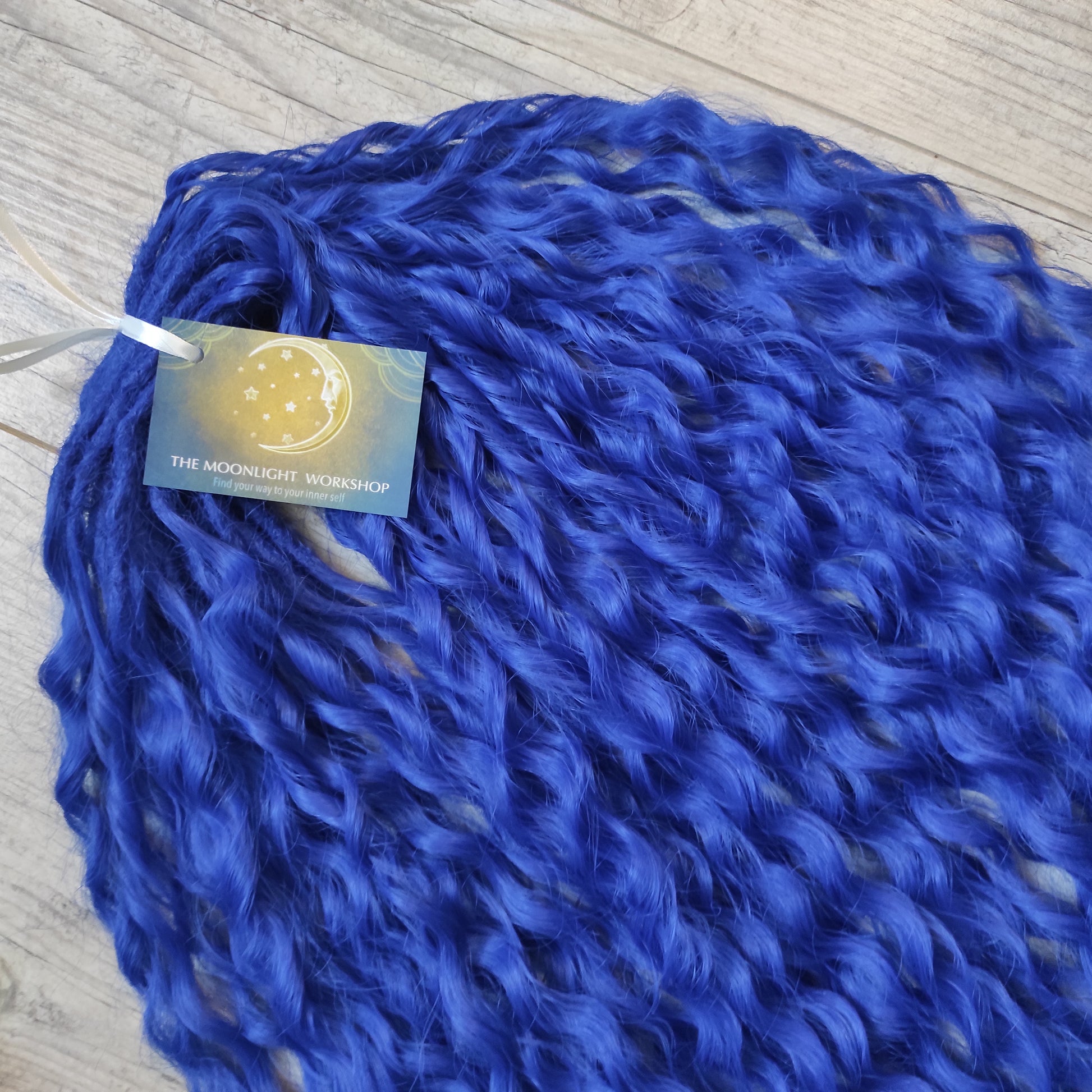 Soft, lightweight, and reusable synthetic sets of double ended regular curls (NOT BRUSHABLE) in blue shades:

1. sky blue;
2. deep blue;

The length:
Standard dreaded - 22-24 inches (55-60 cm), dreaded part `3-4 inches
Push-up / Dolly - 20-22 inches (50-55 cm), dreaded part `4 inches (from working side)