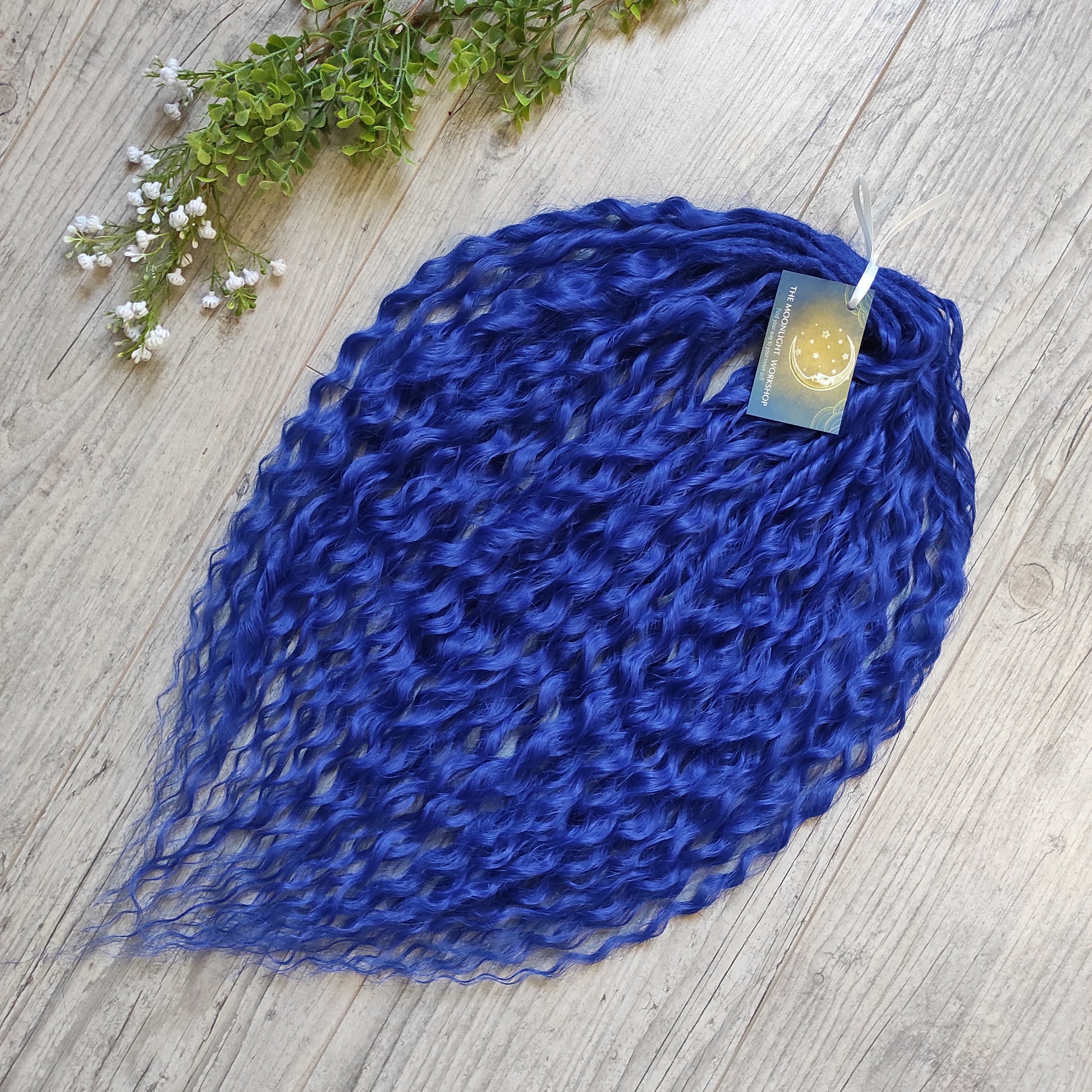 Soft, lightweight, and reusable synthetic sets of double ended regular curls (NOT BRUSHABLE) in blue shades:

1. sky blue;
2. deep blue;

The length:
Standard dreaded - 22-24 inches (55-60 cm), dreaded part `3-4 inches
Push-up / Dolly - 20-22 inches (50-55 cm), dreaded part `4 inches (from working side)
